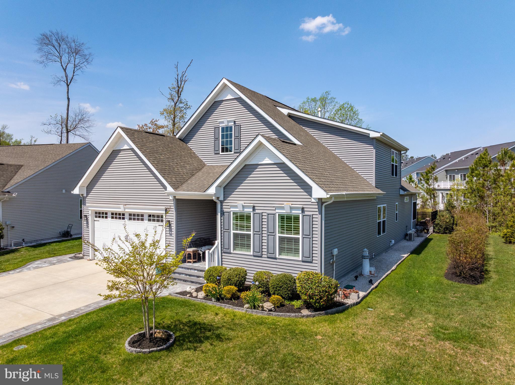 Join us for open house Saturday July 18 - 11:00- 1:00. Welcome to this exceptional single‑family home in the sought‑after Silver Woods community, where resort‑style amenities meet relaxed beach elegance. Enjoy access to a clubhouse, fitness room, saltwater pool, and pickleball courts—all just minutes from the beaches.This thoughtfully designed home offers 3 bedrooms plus a versatile flex space or home office, ideal for today’s beach‑area lifestyle. The first‑floor primary suite is a private retreat featuring a tray ceiling, spacious walk‑in closets, heated non‑slip floors, heated towel bar, dual roman shower, soaking tub, and lighted vanity mirrors. Two additional guest bedrooms and two guest bathrooms provide comfort for family and visitors alike. The chef’s kitchen is perfect for entertaining after a day at the beach, showcasing a large 11 ft. island, stainless steel appliances, pantry, and air‑fryer oven. Upstairs, a bright loft, additional bedroom, and conditioned storage space offer flexibility for guests or hobbies.
Step outdoors and unwind in your own coastal oasis—a fenced corner lot with extensive hardscaping, colorful seasonal gardens, a tranquil Zen garden, and four raised fenced in vegetable beds ready for planting. Rinse off after the beach in the outdoor shower/dressing area, and enjoy the convenience of discreet outdoor storage. 2 car garage including EV charging outlet, utility sink & refrigerator outlet.
Impeccably maintained and rich with upgrades, this home captures the essence of relaxed coastal living. Pride of ownership shines throughout—a perfect full‑time residence or beach retreat near Bethany.