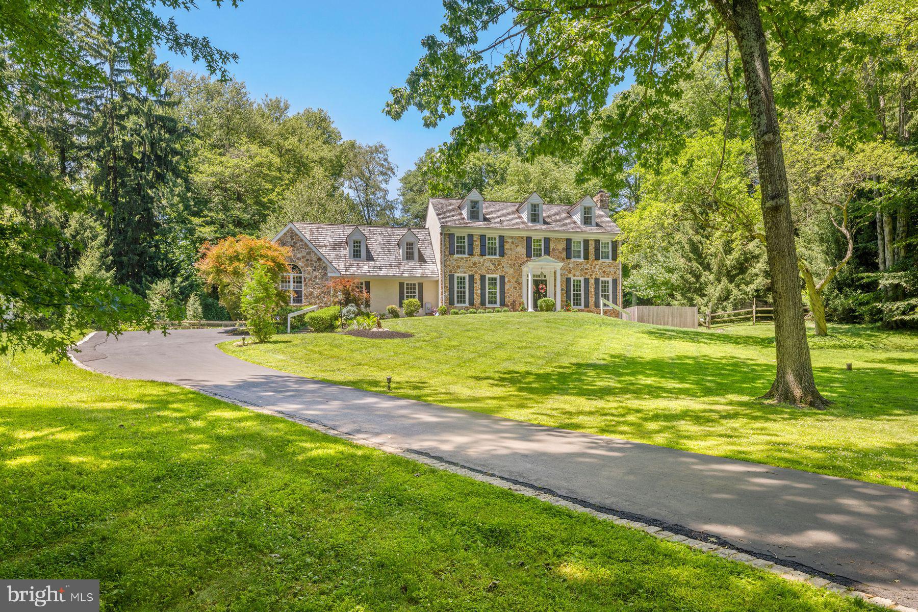 Discover a stunning blend of elegance and comfort in this exceptional 5-bedroom 5.5-bathroom residence, with an addition in 1985 and design features to meet the needs of modern living. Nestled on a generous 2.3-acre lot at the end of a tranquil cul-de-sac, this home offers a serene escape while still being conveniently located in the heart of Radnor Hunt country . Step inside to find an expansive 5,710 square feet of thoughtfully designed living space. The interior boasts exquisite hardwood flooring, complemented by carpeted areas that add warmth and charm. The heart of the home features a spacious kitchen with an island, perfect for culinary enthusiasts. Equipped with top-of-the-line appliances, including a built-in range, double ovens, and a refrigerator, this kitchen is a dream come true and opens to a vaulted ceiling breakfast rm with slider to patio and pool area. A wet bar enhances functionality, making entertaining a breeze. Natural light floods the home through energy-efficient replacement double-pane windows and skylight, creating a bright and inviting atmosphere. The country kitchen adds a convenient sitting area with fireplace which then opens to the family room. Off the kitchen is also an elegant dining room with fireplace, built-ins, and a wet bar for entertaining making this entire area perfect for entertaining and family living. The large living room has an attractive fireplace and past that is a library/office with built-ins and glass pained French doors leading outside. Complementing the first floor is a pantry/laundry rm which leads to a convenient mud room, coat closet and door to the oversized garage with a new epoxy floor covering. On the 2nd floor, the primary suite is a true retreat, featuring a luxurious bathroom with a whirlpool tub and stall shower, and a second primary bath. There are an additional 2 bedrooms sharing a hall bath, plus a large bedroom with an ensuite full bath. The 2nd floor loft with vaulted ceiling overlooking the breakfast area provides endless possibilities for its set up and use. The finished 3rd level can be used as an overflow bedroom or playroom, plus a storage area and a cedar closet. The lower level is finished with a rec room, fireplace, a full bath and walkout to rear yard. This area can also serve as extra guest quarters. There is also full laundry, utility rm, and a workshop. Venture outside to discover your personal oasis. The meticulously landscaped yard features extensive hardscaping, a heated pool, and a spa, all surrounded by lush trees and greenery. Enjoy peaceful views of the garden and woods from your patio, perfect for morning coffee or evening relaxation. The property also includes a shed for additional storage and a three-car attached garage with main floor access, ensuring convenience and ample parking for guests. This home is not just a residence; it's a lifestyle. With features like a laundry area on both the upper floor and basement, every detail has been considered for your comfort and peace of mind. Don't miss the opportunity to own this remarkable property that seamlessly combines luxury, functionality, and natural beauty. Schedule your private tour today and experience the perfect blend of elegance and comfort that awaits you! Convenient access to the popular town of Malvern with wonderful dining and shopping, and quick access to major roadways and commuting.