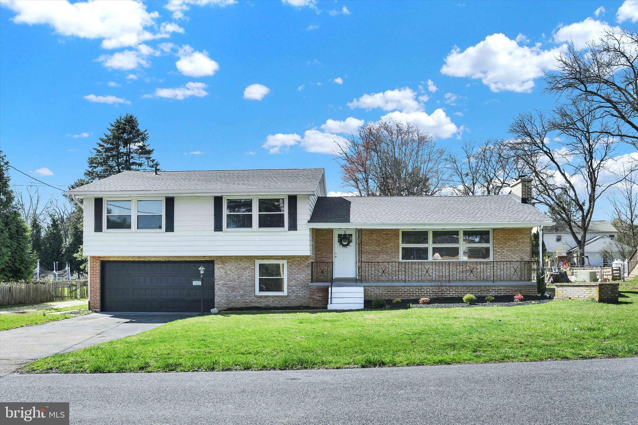 Welcome to this beautifully updated split-level home offering over 2,551 square feet of finished living space and nestled on a spacious lot! Completely renovated and move in ready, this home features so many wonderful features including refinished hardwood floors and fresh paint throughout! Step inside the foyer and be greeted by gleaming hardwood floors and a cozy wood-burning fireplace in the inviting family room. The formal dining room leads to a brand-new eat-in kitchen, featuring hardwood, upgraded countertops, a stylish tile backsplash, and brand-new stainless-steel appliances. A versatile bonus room/office off the garage provides additional living space with outdoor access. Upstairs, you'll find four generous bedrooms all featuring hardwood floors, including a primary suite with double closets, and an updated en-suite bath. The lower-level den with plush new carpet offers even more room for entertaining or relaxing. Outside, enjoy the fully fenced backyard from your private patio, a great space for outdoor enjoyment. Oversized two car garage with storage area and brand new garage door. Newer roof in 2024. Newer hot water heater in 2021. Newer HVAC in 2021. Newer furnace in 2021.  A joy to own!