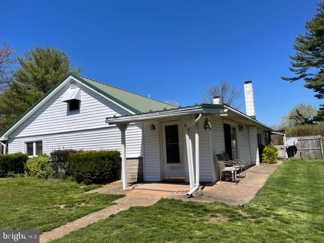 Rancher on .82 acres, Private Setting,  Fenced in yard, 3 Car Detached Garage to the rear has Workshop and Storage, 2 Wood Stoves, 3 Bedrooms, Eat-in-Kitchen with  Breakfast Bar, Living Room, Sunporch and Sunroom, Full Bath, Plumbed for 1/2 Bath in Laundry Room, Crawl Space off Sunroom, Laundry Room on main floor.  Cozy house in semi-private setting.