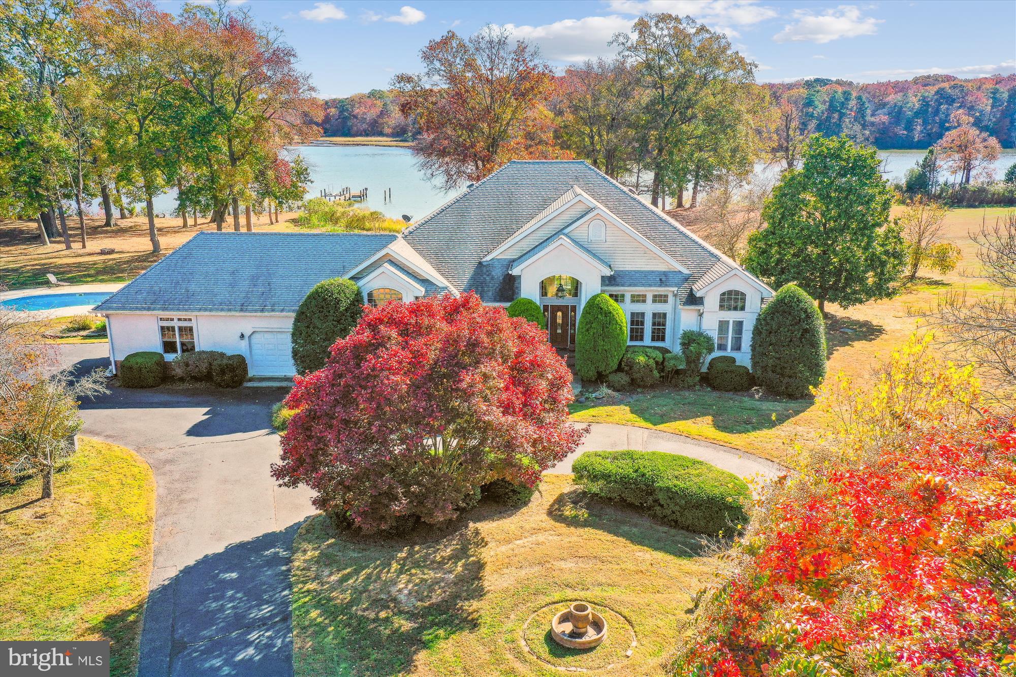 Conveniently located North of Easton with easy Rt 50 access, 9.8+/- acres on the upper Miles River, Southern exposure, dock with lift and electric, exceptional privacy with panoramic natural non developed land water views, with pool and gazebo, 3 car attached garage, exceptionally large  trees and mature landscaping. Split floorplan offering 3,000+/- sf with primary bedroom on one side and other two bedrooms on other side, family room, breakfast nook and kitchen , large office with built-ins and huge game room with expandable 2nd floor and built in stairs. Unique large property with great water for fishing and crabbing. Easy access from the Miles River to Saint Michaels , Eastern Bay and all points on the Chesapeake.
Owner is in the process of providing a new septic and can not provide possession for 90 days.