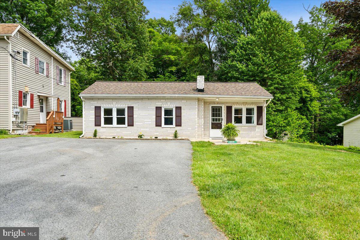 *** Offer deadline set Monday June 10th for 5pm***Welcome to your charming new home in the heart of nature's paradise! This beautifully updated 2 bedroom, 1 bath house boasts a bonus room that can be used as an office or guest space. Step inside and be greeted by brand new flooring throughout, it creates a very inviting atmosphere. Enjoy the spacious back yard, perfect for entertaining guests or simply basking in the natural beauty that surrounds you. With hiking trails and parks just a stone's throw away, adventure awaits right at your doorstep. Equipped with a brand-new roof it ensures peace of mind for years to come, while the outdoor patio provides the ideal spot to relax and unwind after a long day. Convenience is key with a washer and dryer included in this lovely home. Don't miss out on this incredible opportunity to live in a prime location with all the amenities you could ever dream of. Schedule a showing today and make this house your own slice of paradise!