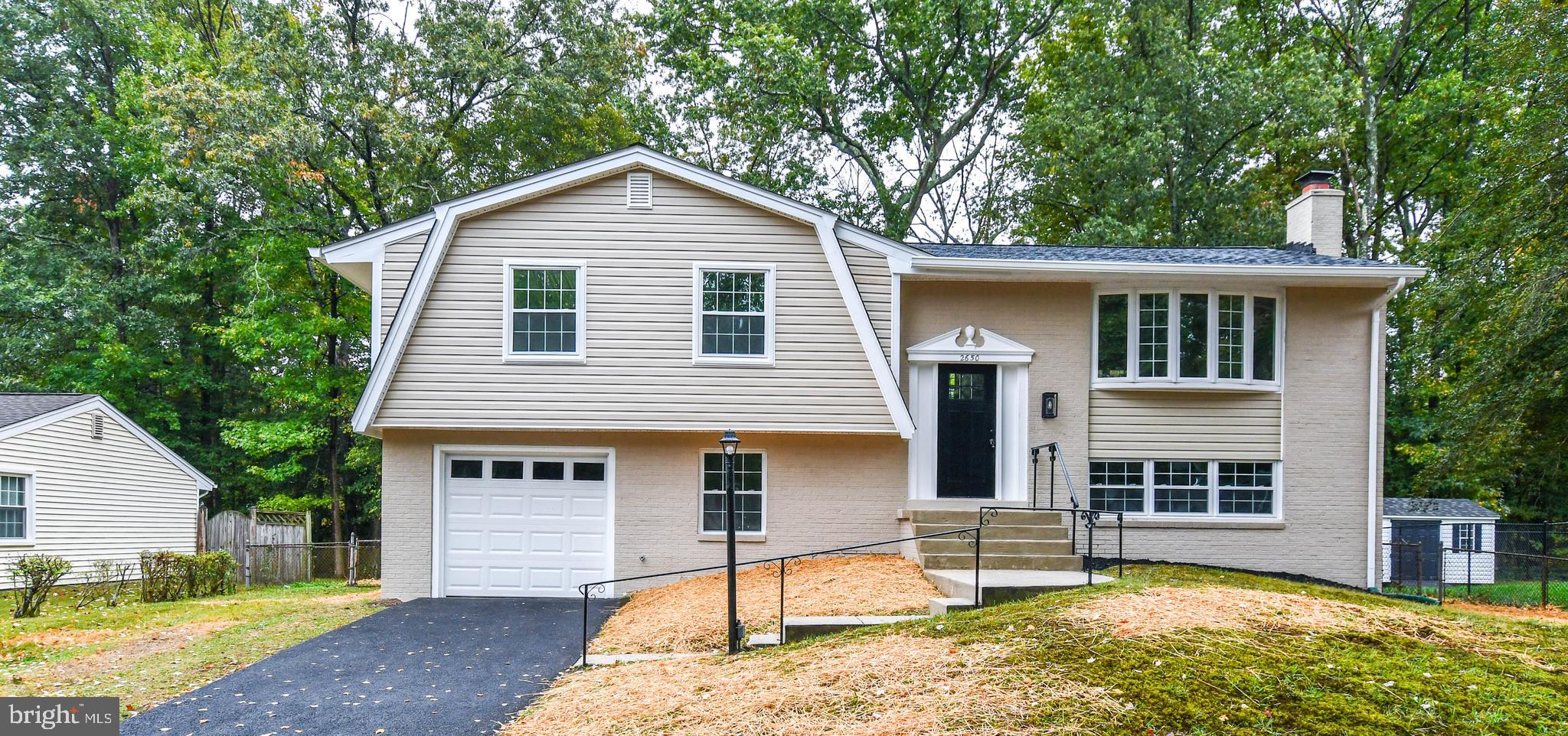 This pristine four-bedroom, three-full-bath home, located in the highly sought-after Pinewood Estates subdivision, rests gracefully on over a quarter-acre lot. As you arrive, the charm of this beautifully renovated home welcomes you, highlighted by its fresh curb appeal and newly paved driveway. From the moment you step inside, the fine craftsmanship and thoughtful details make you feel instantly at home. Warm LVP floors glow beneath custom-painted walls in the spacious living room, creating an inviting space perfect for relaxing or gathering with loved ones. The living room flows seamlessly into the large kitchen and dining area, making everyday living as comfortable as entertaining. The spacious kitchen features stainless steel appliances, self-closing cabinets, Corian countertops, stunning tile flooring, and elegant lighting—every detail chosen to blend beauty with function. All baths have been tastefully remodeled, including a master ensuite designed to feel like a peaceful retreat fit for a king and queen. The secondary bedrooms offer plenty of room for family, friends, or anyone who comes to visit. The oversized family room, complete with a cozy wood-burning fireplace, brings warmth and ambiance to the heart of the home. Step outside to the enormous fenced backyard—an entertainer’s dream. With room for nearly any vision, you could add a pool, a basketball court, a gazebo, and still have space to spare. This home is filled with custom features and countless updates, including new windows, a new roof, new HVAC, a new water heater, fresh paint, and so much more. And don’t forget the garage, perfect for keeping your car or truck clean and secure.