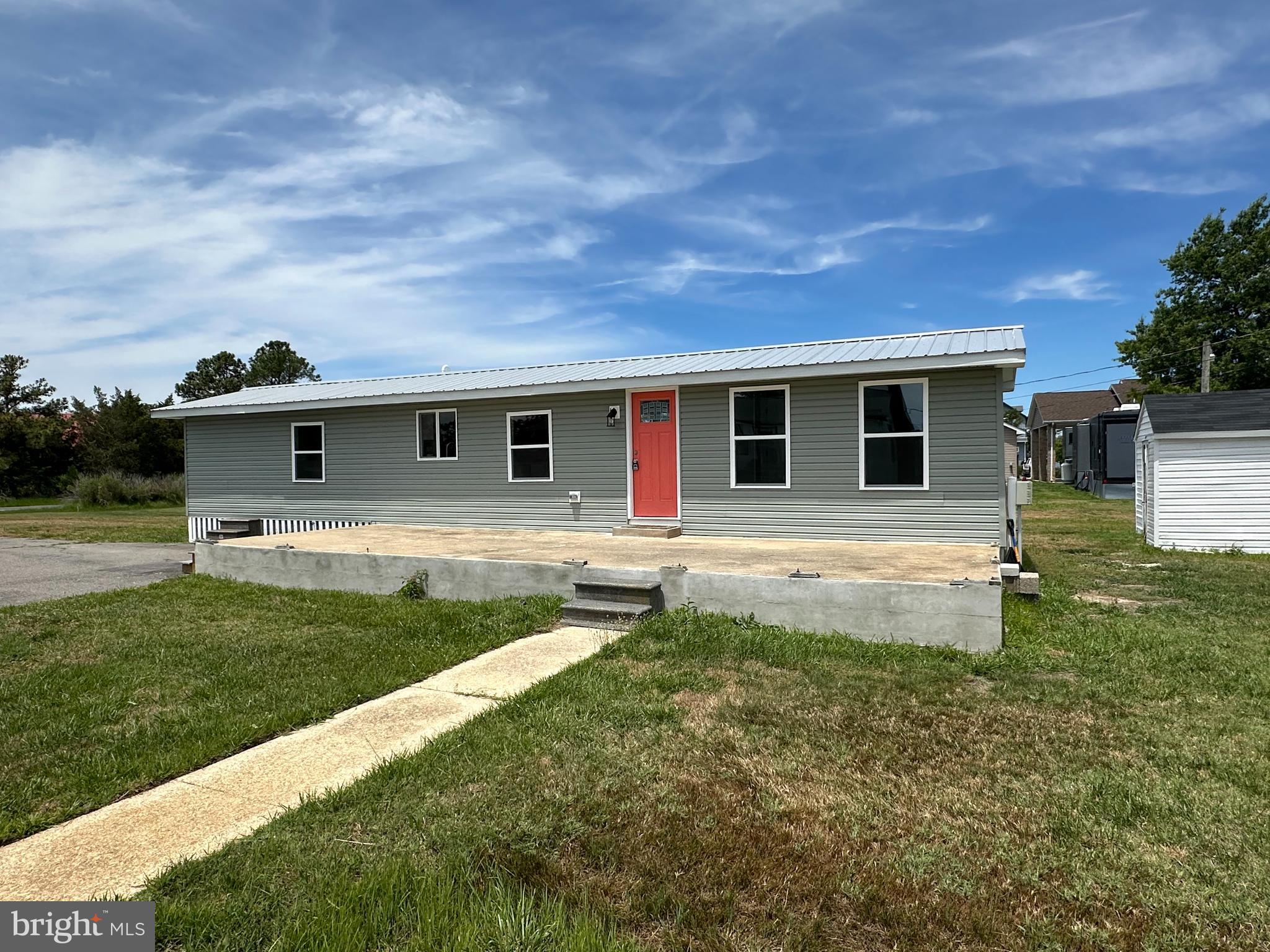 Have you always wanted a weekend retreat in a neighborhood surrounded by water?  You might not have ever been to St Georges Island but you will be in for a treat! Community park, picnic area and boat ramps within about a mile of the property.  Great for fishing, crabbing, boating and outdoor events. Water views from your back yard are already yours.  Peaceful and quiet neighborhood, you will naturally relax and  calm down.  This is a manufactured home that has been completely rebuilt with everything being brand new! Lots of paved parking and two out buildings for your toys and areas to keep a boat. Walk right in and you will have nothing to do but relax and enjoy the new appliances, new plush carpeting,  Control your temperatures with 3 new mini-splits and fans.  There is even a full size washer and dryer for your laundry. Don't need a second home, this this could be the place to call home everyday! Rarely do you find something  newly remodeled at this economical price point. Owner financing may also be available  with acceptable conditions being met.  This is a beautiful area that feels like a waterfront sanctuary with water all around you.