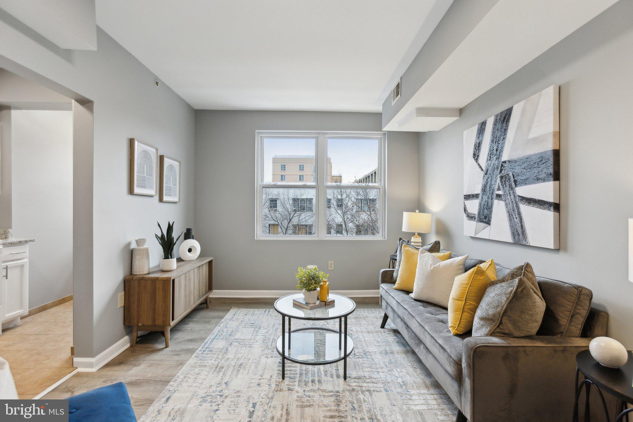 LOCATION, LOCATION, LOCATION, and a lot of natural light. This well planned and spacious 1 bedroom condo is a block from Columbia Heights metro stop, 2 blocks from the bus lines on 16 street, and 4 blocks to the historic Meridian Hill park. With brand new flooring, brand new doorknobs, brand new light fixtures, and fully just painted it is move-in ready and good to go. As you enter the unit and the foyer, to your right is a spacious coat closet and to your left is a bright full kitchen. Ahead of you is the bright and spacious living room and dining room combo. You can set your furniture in several ways and have many options for your set up. Then continue to the bathroom which is just next to the bedroom. You have a relatively large tub and again a frosted window that brings a ton of natural light in for you to get ready in the mornings, or to relax in the tub in the afternoon. To your right is another closet and then to your left is a large and bright bedroom with its own closet. In the pictures you see a queen bed with two large bedside tables, and that should give you assurance that you can easily put a king bed there and still have room for your desk and dresser. This beauty won't stay on the market for too long.