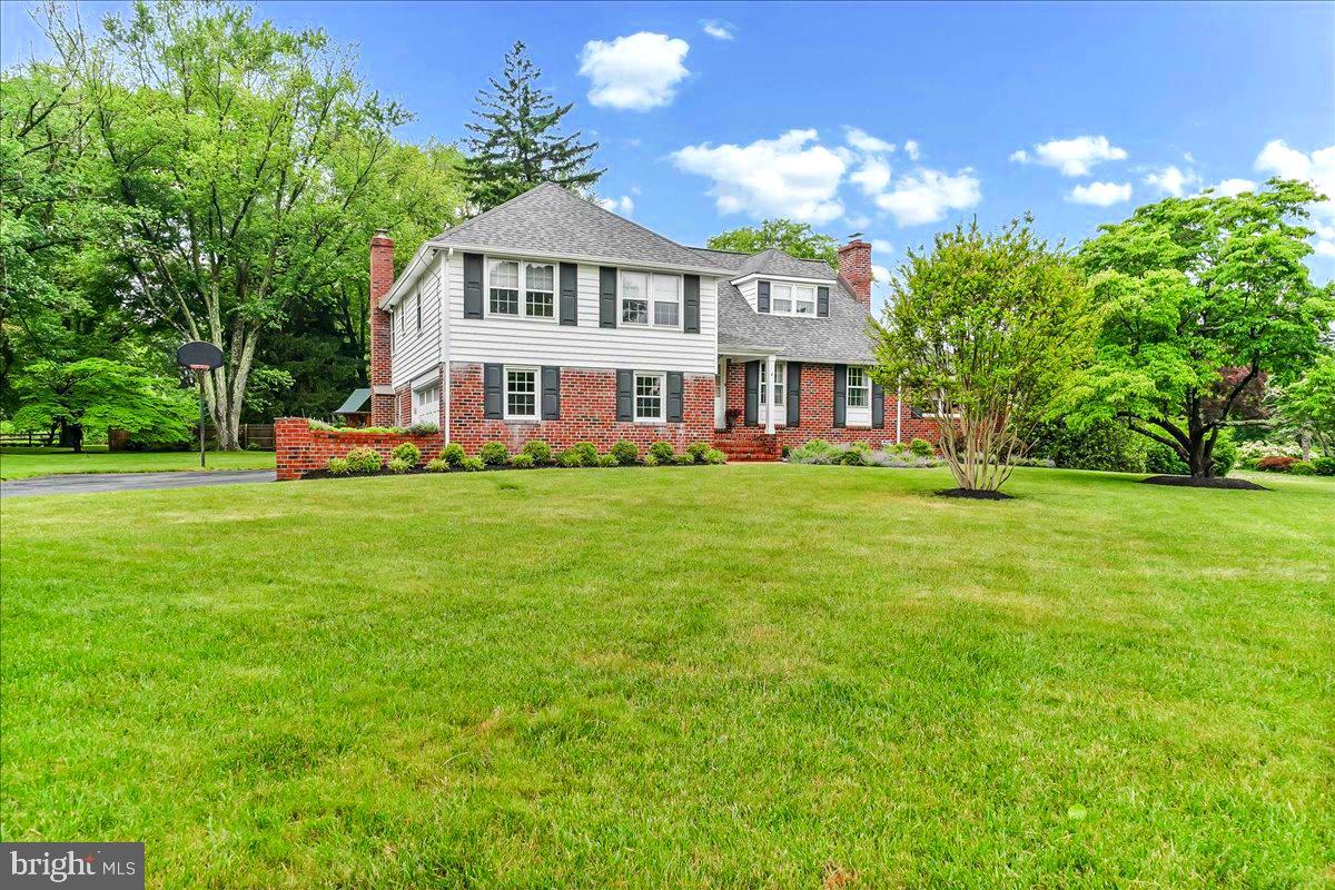 Welcome home to 1026 Waltham Road—an exceptional opportunity in the award-winning Tredyffrin-Easttown School District. Ideally situated on a flat, level lot along a quiet street in the heart of Berwyn, this beautifully updated four-bedroom split-level residence offers over 3,770 square feet of refined living space (public records may not reflect the full square footage).  Step inside to a light-filled interior showcasing high-end finishes and timeless design. Meticulously maintained and thoughtfully updated, the home features gleaming hardwood floors throughout most of the main level. The welcoming foyer opens to an elegant formal living room with a striking white brick gas fireplace, flowing seamlessly into a gracious dining room, perfect for entertaining.  Just beyond, the main-level family room impresses with custom wood paneling, recessed lighting, and built-in bookcases, complemented by a wet bar and beverage refrigerator. This inviting space is enhanced by its own dedicated HVAC system and radiant floor heating, ensuring year-round comfort.  The eat-in kitchen features custom Caesarstone countertops (2022) with an ogee edge, newer stainless steel appliances, and easy access to the private backyard patio—ideal for al fresco dining. The expansive yard, complete with a playset, provides ample space for outdoor enjoyment and entertaining. The first lower level offers a cozy den/ family room with a second gas fireplace, an updated powder room, and a laundry room with direct access to the backyard through the French doors as well as direct access to the two-car garage. The second finished lower level was newly completed (2025) and offers additional living space, featuring a bright, daylight entertainment area with luxury vinyl plank flooring, a new egress window, custom built-ins, and a live-edge seated bar. With separately zoned electric heat, this versatile space is perfect for a guest suite, home office, or additional bedroom.  Upstairs, the second level hosts a spacious primary suite with an updated en-suite bath and a walk-in closet outfitted with California Closets. Two additional bedrooms with generous closet space share a beautifully updated hall bath (2018). The third level offers a large fourth bedroom, currently used as a home office. Additionally the home comes complete with a Cummins Generator (2021), New Roof (2024), New garage doors (2026). This exceptional property combines privacy, comfort, and convenience, just minutes from upscale shopping, fine dining, top private schools, and prestigious golf and country clubs. With newer construction in the area commanding prices over $3.0 million, this home represents outstanding value in a highly coveted location.