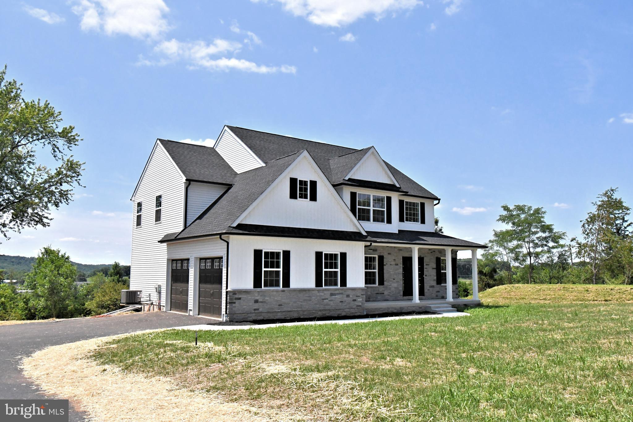 Elegant luxury living awaits on 0.92 acres in the highly acclaimed Perkiomen Valley School District, offering breathtaking, unobstructed rural views that stretch for miles beyond the backyard. This exceptional Tara model single-family home seamlessly blends refined craftsmanship, timeless design, and a truly serene setting rarely found.

From the moment you enter, solid oak flooring extends throughout the entire first floor and continues into the second-floor hallway, creating warmth, sophistication, and lasting appeal. The thoughtfully designed layout features four spacious bedrooms and 2.5 baths, including a luxurious primary suite complete with a spa-inspired bath and freestanding soaking tub—an ideal retreat for relaxation while taking in the peaceful surroundings.

Sun-drenched living spaces are perfectly positioned to showcase the spectacular rear views, creating a seamless connection between indoor comfort and the beauty of the countryside. Whether hosting guests or enjoying a quiet evening at home, the rolling panoramic landscape provides an extraordinary backdrop for everyday living.

Designed for both elegance and practicality, the home also features a mudroom off the attached two-car garage and a convenient first-floor laundry room with utility sink. A full unfinished basement offers endless possibilities for future expansion, recreation, or storage.

Set on a private 0.92-acre homesite with sweeping countryside vistas, this remarkable property delivers the perfect balance of upscale living and tranquil rural charm. A rare opportunity to own the sought-after Tara model in a setting that feels like a private retreat—schedule your private showing today.