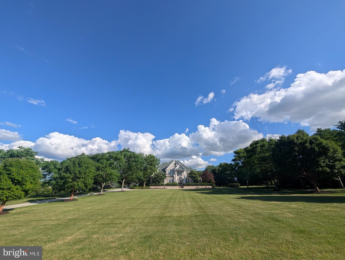 This spectacular stately Tiday built custom home won't disappoint! Your tree lined driveway leads to this beautifully perched manor on 3.55 acres off a quiet cul-de-sac. The home's grand entry leads to a bright and open floor plan. This home does have it all, an expansive first floor master suite (with heated bathroom floor), hardwood inlaid floors, vaulted, tray, and coffered ceilings, dual staircases, two story great room with a wall of windows, multiple fireplaces (propane and wood burning), lofts, decks, patios, and a finished walk out lower level with theater, and a landscape irrigation system throughout the park-like grounds! This home also features an oversized three car garage with plenty of ceiling height to add those lifts for even more cars, !  Privacy, beauty, quality and so much more! Don't wait to come see this home!