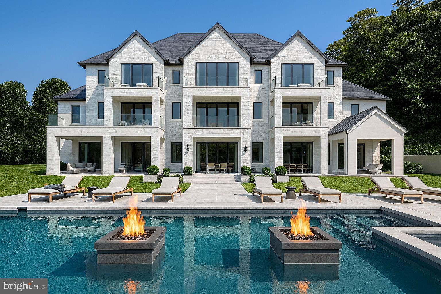 Tucked away at the end of a quiet, private cul-de-sac in one of Potomac’s most sought-after neighborhoods sits something truly special: 2.6 acres of pure possibility. This is your chance to build a stunning contemporary residence of roughly 13,000 square feet that feels more like a private resort than a home.

Imagine a beautifully designed estate with six bedrooms and nine bathrooms, anchored by an incredible primary suite complete with a spacious lounge area, a fireplace, massive closets, and a spa-like bathroom you’ll never want to leave. The rest of the house is just as thoughtful; there’s a dedicated office, a library, exquisite stone and woodwork throughout, and every smart-home feature you could possibly want.

Outside, the fun really begins. You’ve got a cabana with a full outdoor kitchen, cascading waterfalls feeding into the pool, your own basketball/pickleball sport court, a private putting green, and plenty of inviting spots to gather with friends and family. There are organic gardens if you love to grow things, and we’ve even included space for a fantastic indoor spa so you can unwind year-round, no matter the weather.

Picture this: hosting a lively ping-pong tournament on the sport court, practicing your short game on the putting green at golden hour, or gathering everyone around the fire pit with music flowing through the surround-sound system. With parking for up to ten cars, you can easily bring in a house full of guests. And when the party’s over, slip away to your home office or gym, then end the night soaking in the tub of your spa-inspired primary bath while enjoying those serene pool views.

Every last detail here can be customized exactly the way you want it. This is more than just a luxury home; it’s your personal escape, where sophistication meets total tranquility.

Ready to make it yours?