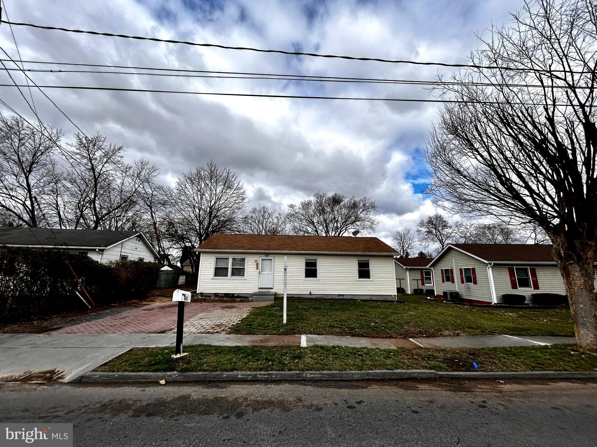 One level living at its best! This centrally located rambler is just minutes from I-81 and Berryville Road, but sits on a quiet residential street. This well maintained home has been fresh painted and is move-in ready! Beautiful hardwood floors run throughout the entire home, except for the kitchen and bathrooms. The eat-in kitchen features white cabinetry, a new SS refrigerator, tile flooring and access to the rear deck and yard.  A spacious primary suite features an updated attached bath, with a fully tiled shower.  Enjoy the upcoming summer months in the flat yard and spacious deck.