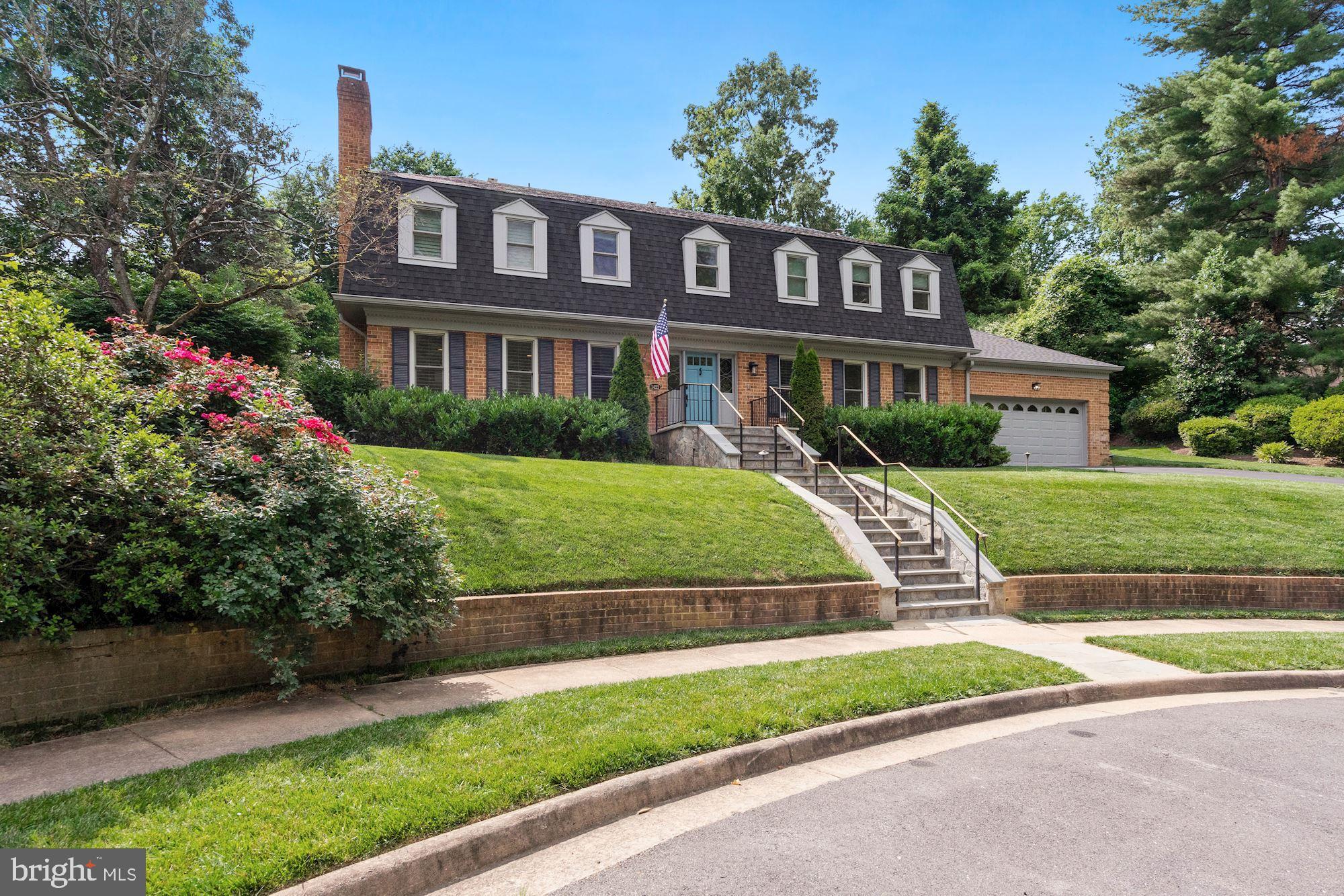 Elegant, All-Brick Center Hall Colonial for sale on a private cul-de-sac in McLean close to the GW Parkway. This lovely and spacious 4 bedroom, 4.5 bath home has been updated from top to bottom to include special touches and high end finishes throughout this one of a kind home. The gleaming hardwoods welcome you into the main level which features a formal living room with gas fireplace, formal dining room with crown moulding and chair rail, family room with paneling and gas fireplace, library/office with built in bookshelves as well as an expanded gourmet chef's kitchen with quartzite countertops, striking backsplash, and high end appliances including the cooktop, double wall ovens, built in microwave, dishwasher and in wall coffee maker. A powder room, laundry room, and access to the 2-car attached garage complete the floor. All four bedrooms are located upstairs including the primary suite featuring a sitting room with an additional gas fireplace and the luxurious attached bath with whirlpool tub, separate shower, dual vanity sinks and heated floors.Two additional full baths are located on the upper floor. The lower level was made to entertain with a full party kitchen including 2 wine refrigerators, oven, dishwasher and microwave. The level also features a recreation space with the fourth gas fireplace, craft room, study space and more! The lower level has plenty of storage and a walk up to the terraced and landscaped backyard with a flagstone patio. This home is conveniently located between downtown McLean and Washington DC with quick access to the GW parkway and I-495. Convenient and private, this home is an oasis amidst the hustle and bustle of DC life. Welcome home to Lady Bird Drive!