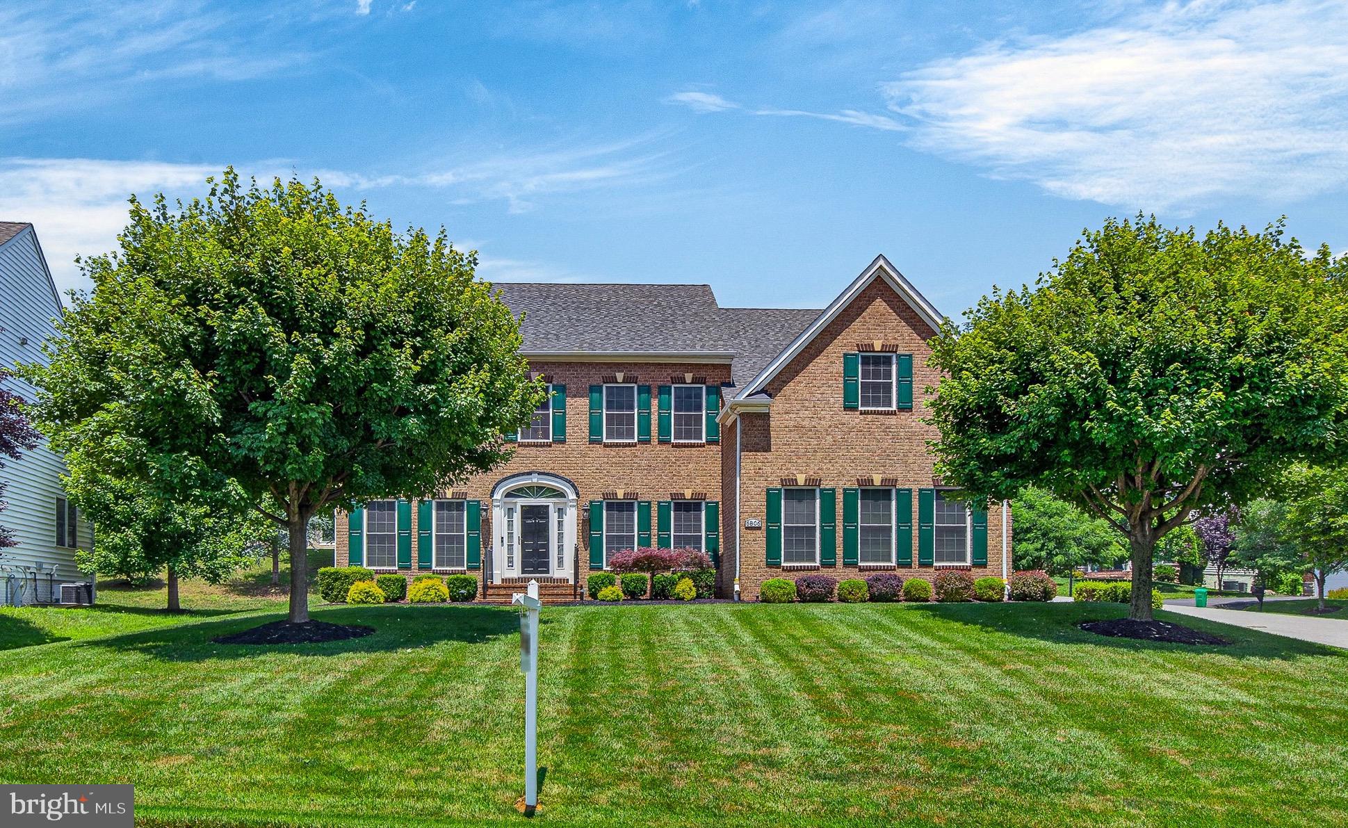 Welcome to this breathtaking corner lot estate, where luxury meets thoughtful design across three beautifully finished levels and over 6,000 square feet of living space. From the moment you step inside, you are greeted by brand new, gleaming hardwood floors that stretch across both the main and upper levels, perfectly complemented by newly updated railings and banisters.
To your left, a formal living room offers a bright and welcoming greeting, while to the right, a striking formal dining room sets a stunning stage for future gatherings. For those who work from home, a spacious main level office sits behind elegant French doors, offering the perfect balance of privacy and style.
The heart of the home is the fully renovated, top to bottom gourmet kitchen. A chef’s dream, it features crisp white cabinetry, beautiful quartz countertops, a farmhouse style sink, and luxury stainless steel Wolf appliances. Modern pendant and recessed lighting illuminate the space, which flows seamlessly into a sunlit breakfast room. From here, you catch your first glimpse of the outdoor oasis, a gorgeous paved patio perfect for grand entertaining, set against a backdrop of a beautifully manicured yard and pristine landscaping, all kept effortlessly vibrant by an installed yard irrigation system. The kitchen also opens directly into a dramatic, two story family room anchored by a cozy gas fireplace, making it effortless to host gatherings or simply enjoy daily life inside and out.
Upstairs, the impeccable craftsmanship continues. The grand primary suite is a true sanctuary, featuring elegant tray ceilings, a spacious sitting area, and a private balcony perfect for morning coffee while overlooking the tranquil grounds. The suite boasts two large walk in closets complete with thoughtfully installed organizers, and a spa like ensuite bath featuring two separate vanities, a large soaking tub, and a separate shower. Three additional spacious bedrooms round out the upper level, including one with its own private ensuite bath.
The lower level is an entertainer's paradise, finished with brand new, plush carpeting throughout and a convenient walk up exit that leads back up to the patio and yard. Movie nights and big games come to life in the separate theater room, which comes fully equipped with a 5.1 channel surround sound system. Just outside the theater, the massive recreation space features a gorgeous wet bar with ample cabinetry, a dishwasher, and a refrigerator. This level also includes the private fifth bedroom, complete with its own walk in closet and access to the home’s fourth full bath, making it an ideal space for guests.
Every detail of this home, from its stunning interior finishes to its exceptional outdoor spaces, has been curated with care, offering a rare blend of grand scale and warm, inviting comfort.