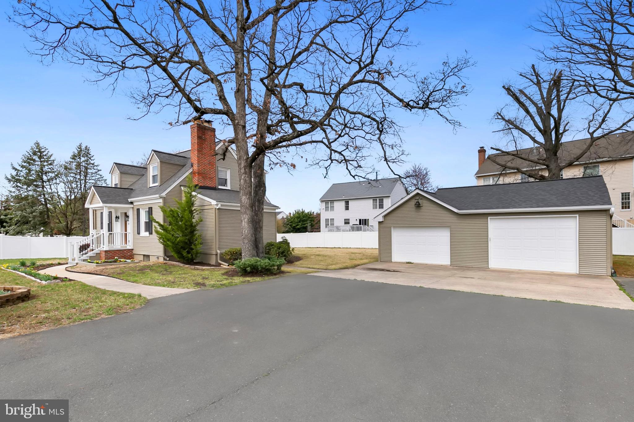 Nestled on nearly half an acre in a prime North Potomac location, this beautifully renovated 3-bedroom, 3-bath Cape Cod-style home offers over 2,000 square feet of living space. Located in the highly sought-after Wootton School District, this home combines thoughtful design with top-tier convenience. The main level features a bright, open layout where the living and dining areas flow seamlessly into a gourmet kitchen.  This chic space boasts modern appliances, generous storage, and sleek finishes. A cozy fireplace and recessed lighting add warmth and charm throughout the sunny living area. Step outside from the main level to a covered patio, ideal for al fresco dining, relaxing, or entertaining in any weather. You'll also find a spacious bedroom on this level, a private den featuring exposed beams—perfect for a home office, playroom, or guest space, and an adjacent full bath. The generous primary suite upstairs includes a walk-in closet and updated en-suite bath, while the third bedroom and full hall bath round out the upper level. The finished lower level provides ample multi-use space with a fireplace, a custom laundry room, walk-out access to the backyard, and a finished storage room. Additional highlights include a fenced and landscaped yard, a two-car garage (725 sq ft), and access to top-rated schools—just 1.4 miles from Travilah Shopping Center, home of Trader Joe's. Big Pines Local Park, offering basketball and tennis courts, a soccer field, and picnic facilities, is within walking distance. Less than 10 minutes to Kentlands, Downtown Crown, and Rio Lakefront for endless shopping, dining, and entertainment options!
