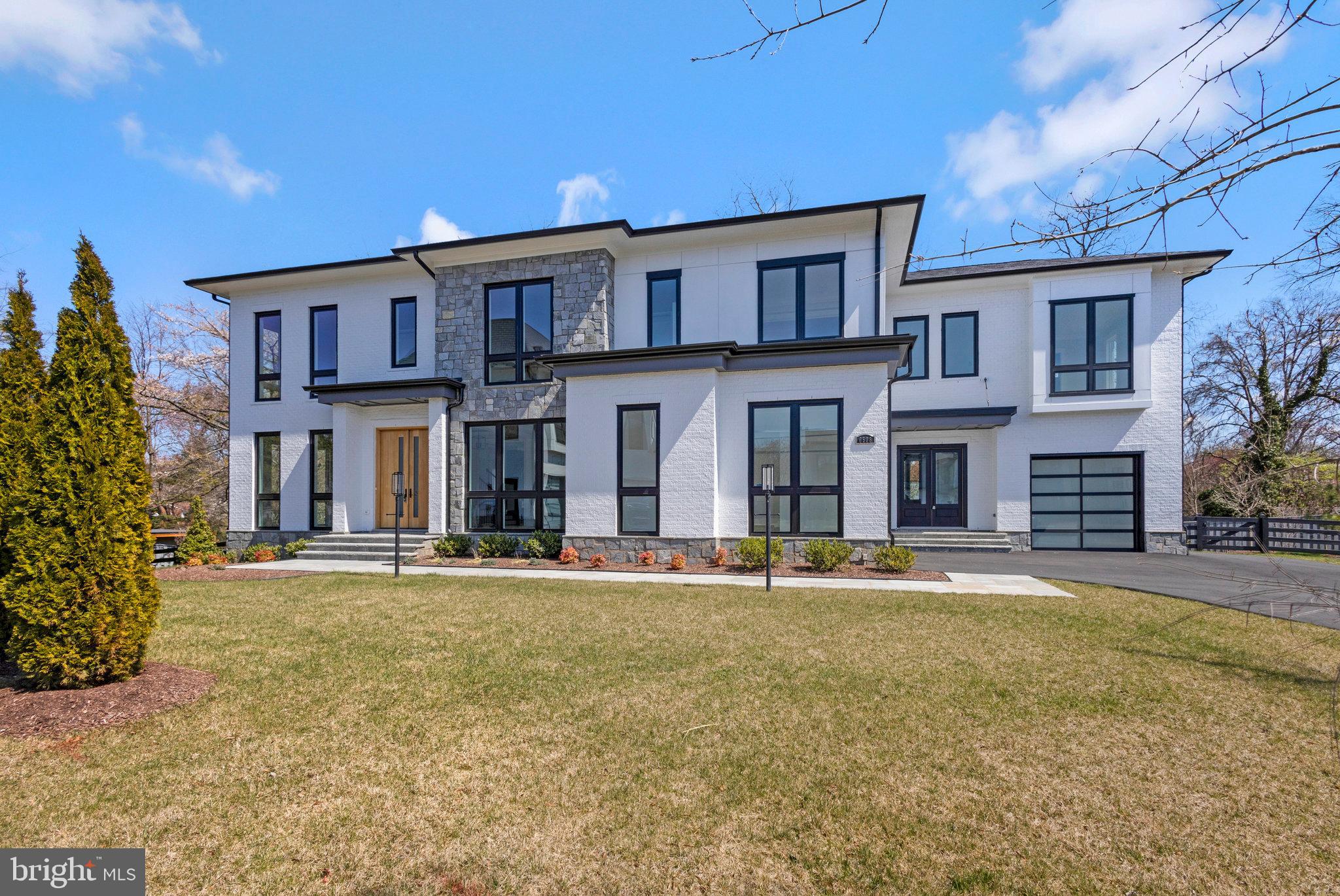 Call Showing Contact  For Appointment. This truly exceptional home is located in our luxurious community of Halls Manor, in one of the most desirable neighborhoods in Mclean. 13 min. drive to Georgetown in our nation’s capital.
 Nestled within a Serene Cul-de-sac you will find our impressive Waterford model on lot Bringing a pleasing blend of traditional and a host of modern amenities with sophisticated design elements. This 10,947 sq ft  (inside and outside living area plus garages) home features 6 bedrooms and 7.5 baths.
Setting the tone for a great first impression with 9ft Sapele Mahogany front doors. When you first walk in you are impressed with our 11 ft ceilings, This lends a very grand feel to the space. The 5 inch Solid American white oak floors set a beautifully warm feeling throughout the home. Our signature floor-ceiling windows offer plenty of natural light, to bring the outdoors inside. The Waterford has a cozy feel with our extensive trim package which includes 10 inch base boards, 8 inch crown trim and 5 ½ inch casing around the windows and door ways.
  The Main Level features a light-filled Family Room, Formal living room, Dining room &  main level suite with f/ bath. The suite has its own private entrance w/car garage. Our homes in Halls Manor feature an elevator to all 3 floors.
  The gourmet kitchen is outfitted with top-of-the-line Viking s.s. appliances.  The expansive area for meal prep also provides  room for storage and entertaining. There is a 6 burner range, custom door fridge, two dishwashers, two sinks, pot filler and beautiful two-tone custom cabinetry. Continuing in the kitchen we have a butler’s pantry with an additional fridge, a Miele Coffee machine and storage for all of your ingredients and snacks . 
The Main Level additionally Features a porcelain tile double sided fire place, butlers wet bar with a sink, beverage fridge, mud room and 3 car garage with epoxy flooring. 
One of the most breathtaking details of this delightful home is the owner’s suite with its own screened in porch, wet bar, sitting area and double sided fireplace. The luxurious owner’s bath features heated floors, steam shower, two toilet rooms, two walk in closets, one with its own island, and a spa like tub fit for a royal bath.
Enjoy 4 generously sized bedrooms on the Upper Level Including a bonus suite in its own secluded side of the home. All bedrooms feature a walk-in closet and on-suite bath. Continuing the upper level you will find a loft waiting for you to turn into an office, playroom, or upper lounge area.  The large laundry room comes with 2 washers and 2 dryers.  
As you make your way down to the lower living area, you will find a whole other world to explore. First you are greeted by an open floor plan space to make it your own. The lower level is equipped with a full wet bar with a stunning waterfall quartz island in a suede finish including a dishwasher, beverage fridge, ice maker and Microwave. Other features include a walk-up basement and lower-level exercise room. Enjoy a day at your own relaxing spa with sauna, steam shower and heated floors. You will also find the 6th bedroom w/full bath and walk in closet. Let’s not forget the tasting room separated by a beautifully done glass door, full of storage for all your wines and beverages. Outside the lower living level there is a full outdoor kitchen, fire table and a covered flagstone patio Beautiful trees provide privacy for outdoor entertaining. 
Outside of the family room is a covered porch with electronic retractable screens. Beautifully finished with James Hardy paneling w/ double sided fire place looking in to the family room.
Moving along with the upper outdoor space you will find a second full outdoor Kitchen with sink, grill, storage and Deckton counter tops. Next to the outdoor kitchen the lounge area with an outdoor fireplace, w/room for dining table and  seated gathering areas.  Please find us on the web.  Premier Homes Group.