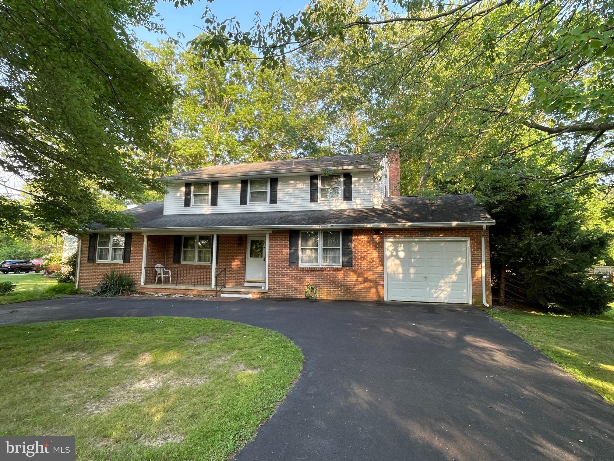 Come and see this 4 bedroom, 2.5 bath brick colonial home with circular driveway and located on a quiet street!  This home will need a little TLC, but will be spectacular when you put all of your finishing touches on it!  As you arrive, there is a ceramic tiled Foyer, large Living Room, formal Dining Room, eat-in Kitchen with electric range, dishwasher, plenty of cabinets and counter space and refrigerator included, and there is a spacious Family Room with fireplace and raised hearth.   You will love that there are hardwood floors throughout most of this home.  There is a convenient Laundry Room and Powder Room on the main level.  There is an extra large Recreation Room or separate Office or Play Room.  The second level has a Main Bedroom Suite with private full bathroom and great closet space, the other bedrooms are large with ample closet space and a full bathroom.  Don't miss the brick paver patio and the large and gorgeous rear yard with beautiful mature trees.  Other fine features include:  New hot water heater, one-car garage, attic with pull-down stairs and flooring.  This location is close to everything:  shopping, restaurants, parks, easy commute to Wilmington and the list goes on and on!!!