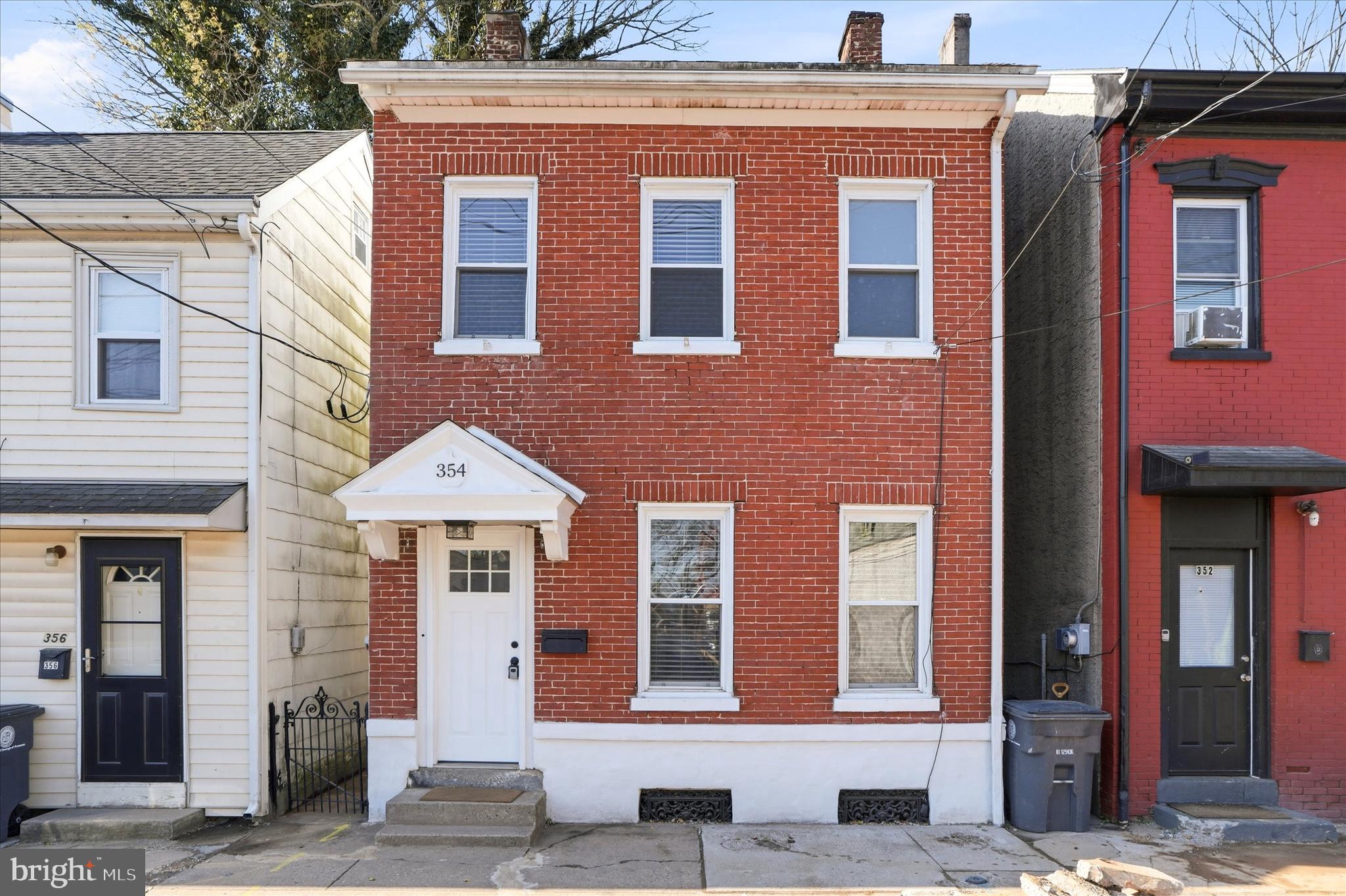 Recently refreshed, updated and turnkey! This all-brick single located in the heart of Pottstown is ready for new memories. Enter the front door and you are greeted by refinished original hardwood floors running throughout both living areas and the dining room. Off the rear is a updated kitchen with new waterproof flooring, dark cabinets and stainless-steel appliances. The first floor also includes an oversized laundry room, remodeled half bathroom and access to the rear covered patio.  The second floor cosists of three generous sized bedrooms with ample closet space and laminate flooring. The second floor also is equipped with a second laundry station and fully remodeled bath.  The finished third floor offers a fourth bedroom for extended living quarters. This home also comes with economic gas heat, vinyl windows and central air conditioning. Schedule your appointment today!