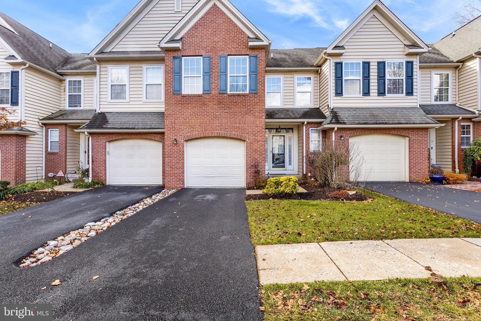 Looking for an extra large townhouse flooded with natural light on all levels AND in a prime location across from the beautiful and famous Longwood Gardens?! Then look no further, this is it! You're welcomed into a large foyer to be greeted with hardwood floors, recessed lighting, and 9 foot ceilings throughout the main level and an open concept floor plan. The dining area opens to the eat-in kitchen with an oversized center island, granite countertops, a tiled backsplash, a pantry, gas cooking, and stainless steel appliances. The living room with a gas fireplace and large windows is off the kitchen. A slider opens to the upper deck which was refinished in 2022.  A large coat closet and half bathroom finish the main level. Continue to the second level to find your primary suite complete with two closets, one a walk-in with custom shelving, a tray ceiling, and a 5-piece ensuite with a water closet, soaking tub, stall shower, and dual vanity. Two other spacious bedrooms, a full hall bathroom, and laundry round out this level. Continue up one more level to find a HUGE loft with two oversized windows and a walk-in closet. This would make a perfect 4th bedroom, home office, home gym, playroom, or anything to fit your needs; the possibilities are literally endless. If this isn't enough space, then descend to the fully finished walk-out basement. Currently set up as a fully equipped 4k home theater with a surround sound system, this area could be a great recreation room. It also has a half bathroom for convenience, a sliding door out to the covered patio, and a storage room. The HOA covers all lawn maintenance, snow removal, and bi-annual gutter cleanings. Schedule your showing today!