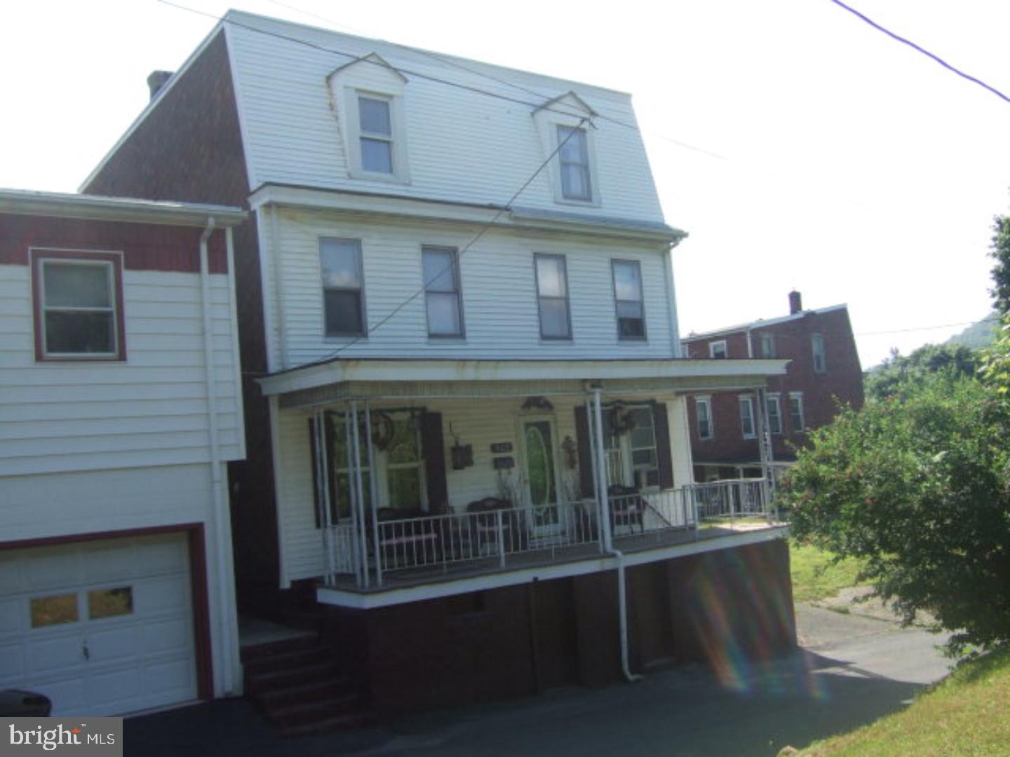 SPACIOUS HOME located within walking distance of the schools. 2 sided duplex converted into 1 home. Partially renovated. Large eat-in kitchen. Old world charm displayed living and dining area. Cute cottage garden complete with Koi pond and fenced in back yard. Laundry room 5'4 x 5'. Bonus rooms on 2nd floor may be used as walk-in closets/office/play rooms or extra smaller bedrooms. Large covered front porch. Electric fireplace in front entry room remains. Convenient parking in front of home and across street. <marquee>$2000 BUYER AGENT BONUS !! </MARQUEE>  Mailing Address Continued: Pottsville  Color: White  Amp: 200