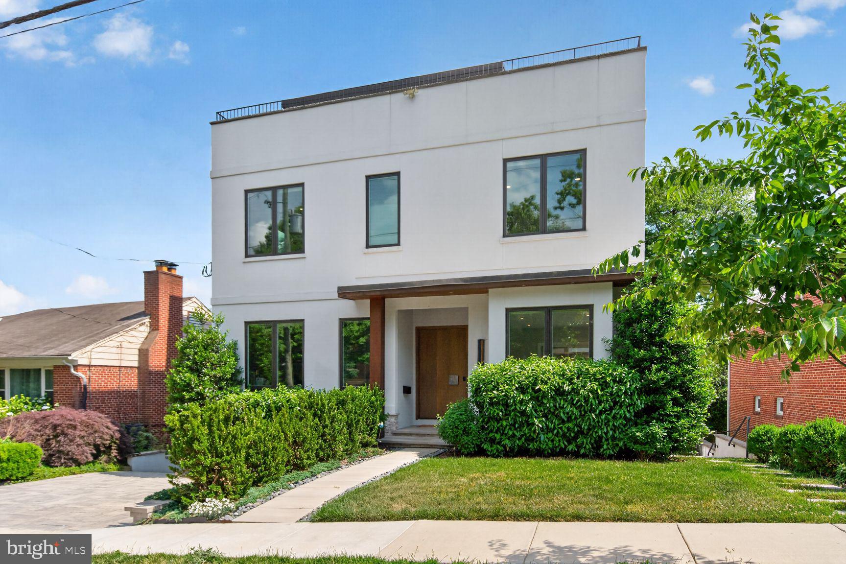 Modern luxury meets elevated city living at 4512 Salem Lane NW, a striking contemporary residence tucked into the heart of the Palisades. Built in 2020 and spanning approximately 7,300 square feet across four impeccably designed levels, this 6-bedroom, 6.5-bath home offers sophisticated architecture, exceptional scale, and seamless indoor-outdoor living.

A beautifully landscaped approach and covered entry open to expansive entertaining spaces filled with natural light, soaring ceilings, and refined modern finishes throughout. The open-concept main level is anchored by a chef’s kitchen with premium Miele appliances, Dekton countertops, Scavolini cabinetry, an oversized island, and an adjacent pergola-covered courtyard that is perfect for al fresco dining and effortless entertaining.

Designed for both comfort and functionality, the home features an elevator servicing all levels, multiple wet bars, spacious en suite bedrooms, and a luxurious primary suite complete with a spa-inspired bath, soaking tub, and custom walk-in closet. The upper level culminates in a breathtaking rooftop terrace and suite with sweeping views.

Complete with its own living space and kitchen, the fully finished lower level offers exceptional flexibility as a private-entry two-bedroom, two-bath guest or in-law suite. Additional highlights include hardwood floors, extensive built-ins, a mudroom, abundant storage, and an attached two-car garage with EV charging.

Ideally located in one of Washington’s most coveted neighborhoods, 4512 Salem Lane NW combines modern elegance, thoughtful design, and premier convenience in a truly exceptional offering.