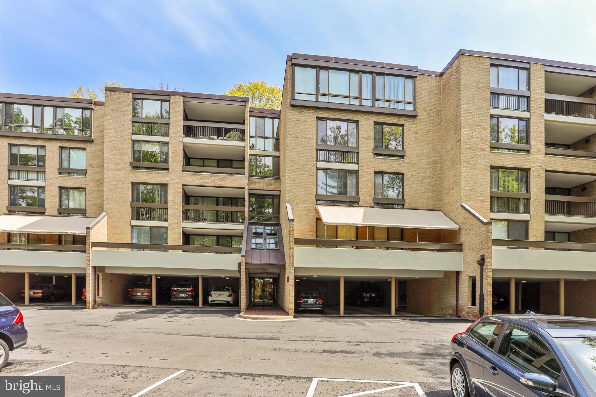 Welcome to Sumner Village! The award winning community is tucked into a 28 acre tract of wooded land in Bethesda, providing quick access to DC, major commuter routes as well as shopping and dining in downtown Bethesda. Unit 301 is a spacious 1,391 s/f 2 BR 2 BA unit that has been updated and cared for by its owners.  It offers natural wood floors and crown molding throughout, custom built-in cabinets in the living room and 2nd bedroom, a wood burning fireplace in the living room, update baths with ceramic tile floors in both bathrooms, a private balcony off the living room looking out to a wooded area, washer/dryer in the unit, walk-in closet in the master bedroom, a large hall closet for storage plus additional secure storage on the ground level.  THIS UNIT ALSO HAS 2 COVERED PARKING SPACES (26/27) THAT WILL CONVEY WITH THE PURCHASE OF THIS UNIT. Sumner Village offers access for both recreational and social activities and has courts for tennis and pickleball, a large outdoor pool and a handsome, contemporary Community Center.  The Center includes a kitchen and bar, a library, an intimate atrium lounge with fireplace, and a common room overlooking the pool.  It also has saunas and a well-equipped exercise room.  For a fee, residents may use the Center for private parties.  On the grounds, there are two tennis courts and gently lighted winding walkways. Sumner Village's Community Association sponsors frequent activities in the Community Center, including morning coffees, book groups, dinners, evening functions with speakers, concerts and holiday events.