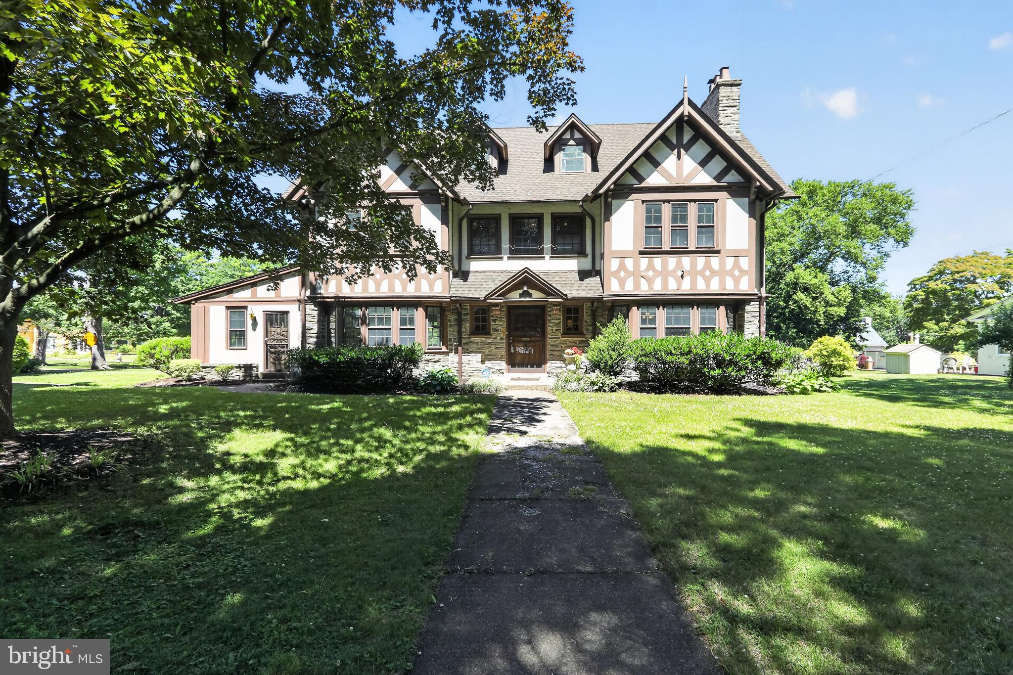 Welcome to 1 Latham Park — a stunning Tudor estate set behind private gates, offering a sense of privacy and serenity that's genuinely hard to come by. This is the kind of home that stops you in your tracks the moment you arrive.

With six spacious bedrooms, four full baths, two half baths, and over 4,300 square feet of living space, there's room here for everything — big gatherings, quiet mornings, work-from-home setups, and everything in between. The architecture is genuinely special: gracious proportions, rich detailing, and original craftsmanship that give the home real character and warmth.

What makes this an especially smart buy is what's already been done. The current owners have invested over $135,000 in meaningful upgrades — two-zone high-velocity central air conditioning, extensive plumbing improvements, a radon remediation system, updated lighting throughout, fresh interior paint, a brand-new washer and dryer, a new garbage disposal, professionally enhanced landscaping, and a full security system. These aren't cosmetic touches — they're the kind of improvements that give buyers real confidence and real savings down the road.

Inside, large windows pour natural light into generous formal and informal living spaces, making the home feel bright and alive. Outside, the lush, mature landscaping wraps the property in a tranquil, park-like setting that's all your own.

Add in easy access to Center City Philadelphia, regional rail, great dining, and major commuter routes, and this home delivers a lifestyle that's both peaceful and incredibly convenient. It's a rare combination — and a genuine opportunity for the right buyer.