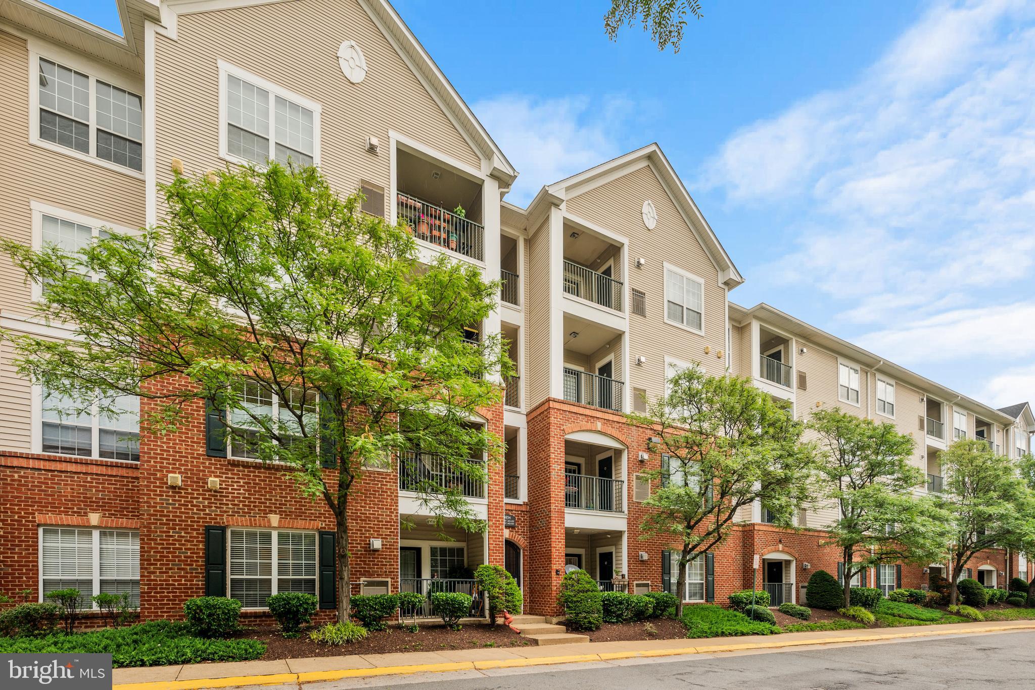 Welcome home to Exchange at Van Dorn! This light-filled two-bedroom condo blends thoughtful updates with an unbeatable Alexandria location, incredible amenities, and two assigned garage spaces. Inside, crown molding and recessed lighting lend a polished, finished feel. The kitchen features rich wooden cabinetry, newer stainless steel appliances, and new waterproof luxury vinyl flooring. A convenient pass-through and breakfast bar connects the kitchen to the dining and living rooms, where gleaming hardwood floors set the stage for effortless entertaining and comfortable everyday living. Your generously sized primary suite offers a peaceful retreat, complete with plush carpeting and a private en suite bathroom. A second bedroom with its own attached bathroom and soft carpeting is ideal as a home office, guest room, or whatever suits your needs. Step outside to your private covered balcony - the perfect spot to relax and unwind. Everyday convenience is covered with an outdoor storage closet on the balcony, an in-unit washer and dryer (2022), and assigned parking in a covered garage. Additional upgrades include a smart thermostat, smart lighting, and newer HVAC (2022). Community amenities are plentiful, including an outdoor pool, a fitness center, a clubhouse with business center, basketball court, playground, and gorgeous professionally maintained landscaping. Conveniently located just minutes to Washington DC, Wegmans, Safeway, Old Town Alexandria, Kingstowne, Hoffman Center, Springfield Town Center, Amazon HQ2, The Pentagon, and the new West End development with Inova Alexandria Hospital. Quick access to I-495, I-395, Van Dorn Street, King Street, and Route 1. Free DASH Shuttle service to the Eisenhower Avenue Metro Station makes commuting a breeze. Schedule a private tour of your beautiful new home today!