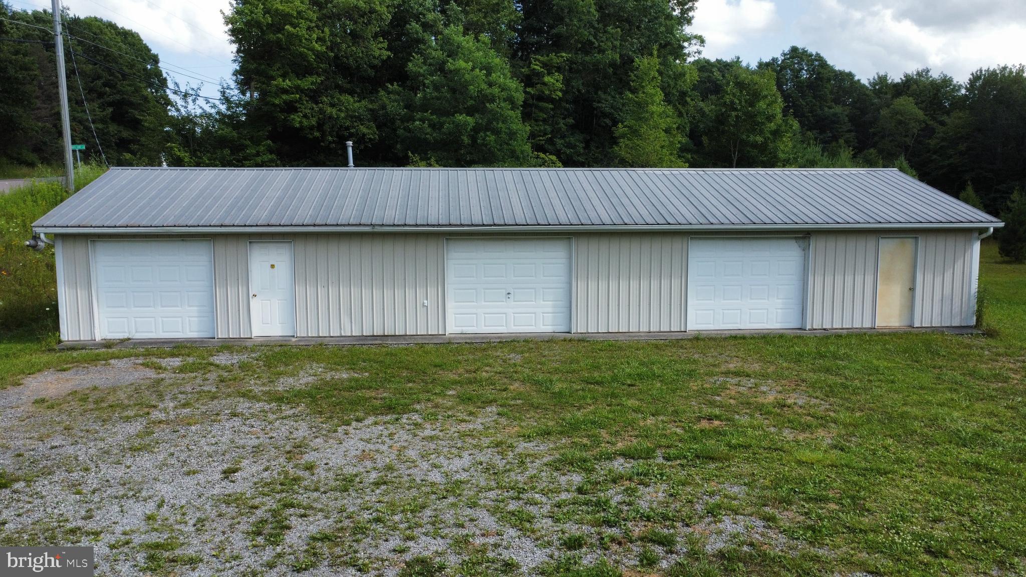 Excellent investment opportunity available now! Flat and mostly clear 2.34 acre lot with an existing 65'x25' Steel pole building outside of zoning restrictions! With access to public utilities and existing infrastructure Possible uses could be storage or layover yard for a contractor, storage units for an investor,  car lot, new home build, or any other possibility the new owner can imagine. Call today before this opportunity is gone!