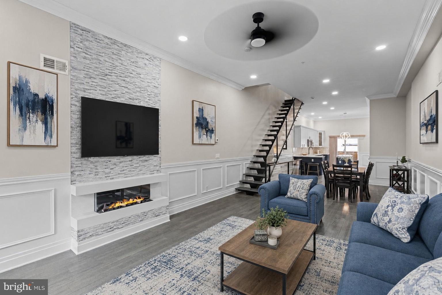 Welcome to The Estates at Queen Village, a collection of newly constructed luxury townhomes in one of Philadelphia’s most sought-after neighborhoods, offering sophisticated city living with 4 beds and 4.5 baths with all upgrades including and a 10-year tax abatement. Built with exceptional quality and attention to detail, this stunning residence features a premium TPO roof, durable plastic roof tiles, ZIP System exterior sheathing, all-brick and cement board exterior elevations, and sound-deadening construction between floors for enhanced privacy and comfort. The home seamlessly blends modern elegance with timeless design, featuring an expansive open-concept main level perfect for entertaining, complete with a gorgeous chef’s kitchen showcasing quartz countertops, striking navy and white cabinetry, professional-grade Viking appliances including a built-in refrigerator and gas range, and an oversized island ideal for dining and gathering. Natural light pours throughout the home, highlighting the spacious layout and high-end finishes at every turn. The second floor offers two generously sized ensuite bedrooms, while the entire third level is dedicated to a luxurious primary retreat featuring a custom walk-in closet, wet bar, spa-inspired bathroom with radiant heated floors, a soaking tub, glass-enclosed shower, dual vanities, and floor-to-ceiling porcelain tile, plus a conveniently located laundry room. A full-length rooftop terrace with panoramic city views and upgraded lighting creates the perfect setting for entertaining or relaxing under the stars. The finished lower level provides flexible living space ideal for a home office, gym, media room, or guest suite, and is enhanced by radiant heated floors, a full bathroom with floor-to-ceiling porcelain tile, and an additional laundry area for added convenience. Thoughtfully designed with premium finishes, superior construction materials, and exceptional craftsmanship throughout, this remarkable Queen Village home offers the ultimate luxury urban lifestyle surrounded by charming tree-lined streets, acclaimed dining, boutiques, and cultural attractions. Taxes and Association fees are not $1 and are TBD. Taxes and square footage are the responsibility of the buyer to have verified independently.