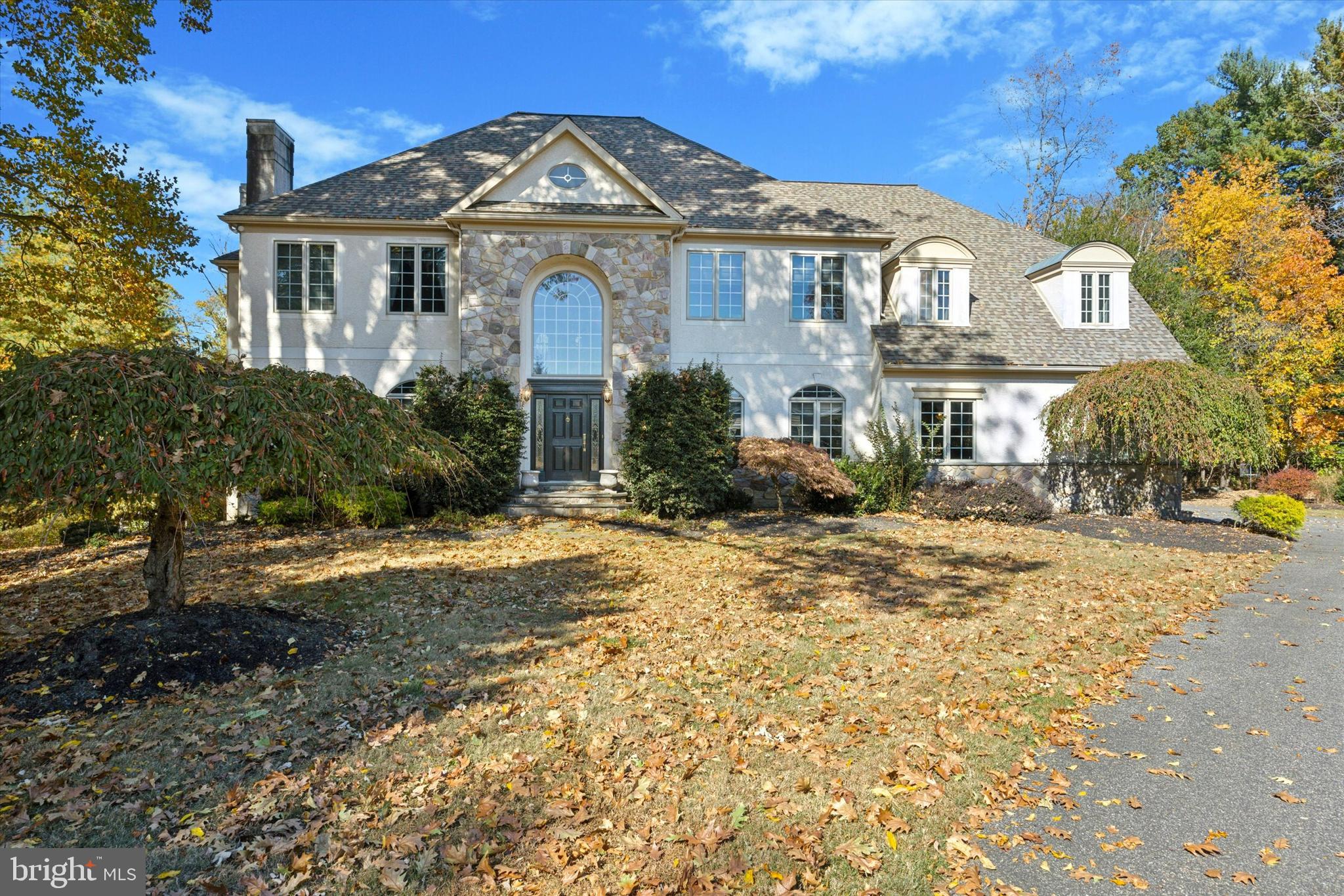 Welcome to 225 White Tail Lane, a stunning custom-built residence nestled on a serene cul-de-sac in Media/Upper Providence, PA. This expansive home boasts over 5,900 square feet of luxurious living space, perfectly situated on a one-acre level lot, surrounded by trees for ultimate privacy.
As you enter through the prestigious two-story foyer, a sweeping staircase invites you into an elegant world of comfort and sophistication. The main floor features palladium windows that flood the spaces with natural light, highlighting the grandeur of the formal living room with its inviting fireplace. Host unforgettable dinners in the spacious dining room, complete with a butler’s pantry for effortless entertaining. The heart of the home—the gourmet kitchen—will inspire your culinary creations, featuring a breakfast bar, gas cooking, and a double oven.
The family room, another cozy retreat, opens through French doors to a large exterior deck, perfect for enjoying peaceful mornings or vibrant gatherings.
Retreat to the luxurious primary suite, a true oasis with an in-wall fireplace, three walk-in closets, and a spa-like ensuite bath featuring a soaking tub, a huge stall shower, and double vanities. Two additional bedrooms offer walk-in closets and share a Jack-and-Jill bath, while a second ensuite bedroom adds convenience for guests.
This meticulously designed home showcases exquisite custom details, including hardwood flooring, recessed lighting, and top-of-the-line finishes throughout. With an unfinished walkout basement and an attached three-car garage, the possibilities are endless.
Don’t miss your chance to experience the tranquility of this exquisite property, just minutes away from shopping and dining. Discover the perfect blend of luxury and location at 225 White Tail Lane—where your dream home awaits.  Stucco report available upon request. 
________________________________________