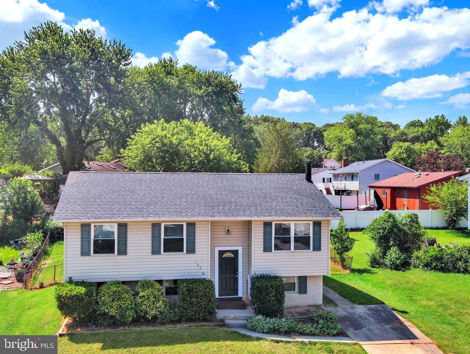 Beautifully maintained from top to bottom, this four-bedroom split-foyer home offers the perfect combination of pride of ownership, major updates, and the opportunity to add your own personal touches. Recent improvements include a new architectural shingle roof (June 2026), luxury vinyl plank flooring throughout the upper level, foyer and stairs (June 2026), a water heater replaced in 2022, and most windows replaced in 2019.

The upper level features a spacious living room that flows seamlessly into the kitchen, creating an inviting space for everyday living and entertaining. From the kitchen, step outside to a large deck overlooking the beautifully landscaped, fully fenced backyard. Three generously sized bedrooms and a full bath complete the main level. While the kitchen and bathroom have been well maintained, they also present an excellent opportunity for a buyer to update and customize to their own style.

The finished lower level offers a spacious recreation room centered around a cozy wood stove, a large fourth bedroom, and a utility/laundry room with potential to add a second full bathroom, providing flexibility for future expansion.

Conveniently located just minutes from BWI Airport, major commuter routes, shopping, restaurants, public transportation, and everyday conveniences, this home also offers fantastic neighborhood amenities. Enjoy a short walk to Barlow Field, featuring basketball courts, playgrounds, picnic areas, and open green space. Residents also have the option to join the voluntary Village of Olde Mill community association for access to the neighborhood swimming pool.

Move right in and enjoy the many recent improvements while making this well-cared-for home your own.