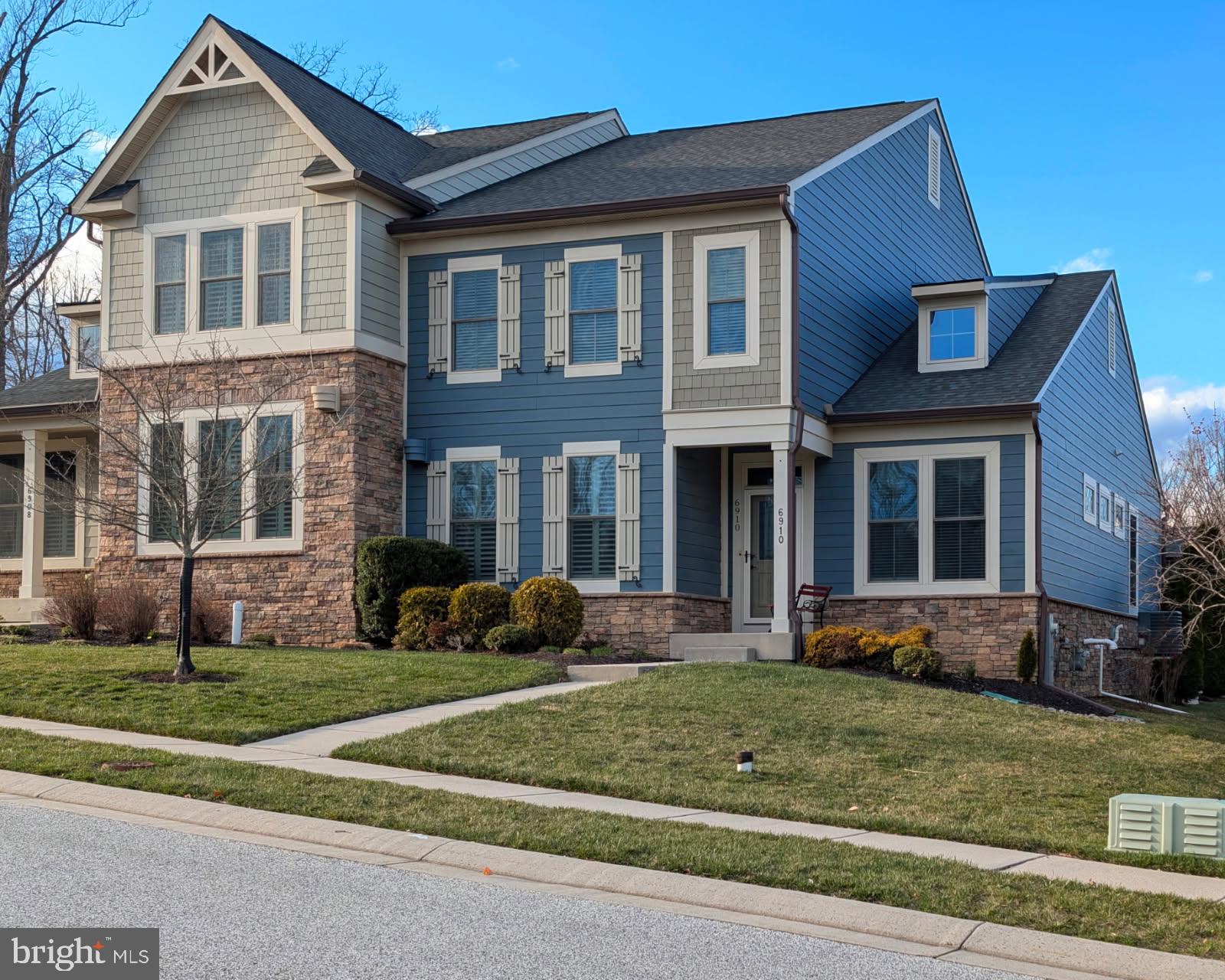 Towson’s Only 55+  Villa Home Enclave!  Wonderful Opportunity in Stoneleigh Summit — Nestled between the popular Stoneleigh and Maxalea neighborhoods, this exceptional residence offers a blend of great design features and a private gated community. With only 36 homes in this gated community, opportunities are rare. A Truly Effortless Lifestyle!  
From the moment you arrive, the curb appeal is undeniable — Wedgewood blue Hardie Plank siding, natural stone accents, a covered front entrance, a two-car garage plus golf cart bay, and generous driveway parking. Designed for effortless one-level living, the main floor features:  a spacious primary suite with luxurious bath, double vanity, walk-in shower, and expansive walk-in closet. Main-level laundry and mudroom just off the attached garage. The 9-foot ceilings and open floor plan create a light-filled layout.
The gourmet kitchen anchors the home with granite countertops, stainless steel appliances, double ovens, a separate cooktop, a built-in microwave,  a huge island/breakfast bar, and sleek cabinetry — perfect for entertaining or quiet evenings at home. The living room features beautiful built-in bookshelves that are framed by a picturesque gas fireplace and dramatic ceilings that extend to the upper-level living spaces. The rear door leads to a composite deck with vinyl railings. The rear deck offers additional space to enjoy morning coffee. The upper-level has awesome flexibility, including an additional gathering area/loft, along with two generously sized bedrooms, a full hall bath, and an additional large storage closet.
The fully finished lower level expands the home’s versatility, featuring a beautifully appointed wet bar with seating, a huge family room, and an additional bedroom and a full bath. This home's floor plan is ideal for hosting house guests while maintaining privacy and comfort.
Stoneleigh Summit offers a true low-maintenance and turnkey lifestyle. The HOA handles lawn care, gardens, and snow removal, allowing residents to focus on enjoying life. Perched above and adjacent to the Country Club of Maryland’s 18 holes of manicured greens, driving range, pro shop, and recently renovated restaurant and lounge, the community combines natural beauty with coveted recreation.
Perfectly positioned on a desirable lot, the neighborhood borders a serene wooded preserve. It is located on the 14th fairway, offering tranquil views and effortless access for those who choose to pursue a membership. Tucked away yet just minutes from Towson’s shopping, dining, and premier medical centers, academia, this home offers the best of all worlds — peaceful retreat and everyday convenience—a rare offering in an exceptional community.