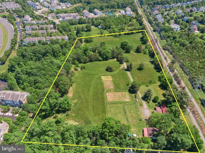 Welcome to Dominion Oak Farm, a scenic and serene 9.11-acre property tucked away in the heart of Ashburn where you can build your dream home 

. This rare parcel is accessed via a private drive and bordered along its southern edge by the W&OD Trail, offering direct access to miles of walking, biking, and equestrian recreation.

The land features mature trees, a large fenced area ideal for farming, gardening, or animal use, and open fields perfect for horses—making it an equestrian’s dream home. Whether you're envisioning a private farm, a boarding and riding facility, or simply want space to enjoy nature, this versatile property offers a unique blend of seclusion and opportunity.

A small pond is nestled in the northern corner, while a creek runs along the eastern boundary, enhancing the property’s natural beauty. Dominion Oak Farm is protected by a Conservation Easement, preserving its charm and open space while allowing for specific development under outlined guidelines.

An existing 1920s farmhouse and multiple outbuildings/structures convey as-is, where-is. The farmhouse requires extensive rehabilitation or can be torn down and replaced with a new home up to 15% larger in taxable living square footage. There are no limits on basement or below-grade square footage, offering flexibility in design. Per the Open Space Conservation Easement, the replacement home must remain similar in scale and footprint.

 The deed and plat are available in the document section for review.

Experience the tranquility of the countryside with all the conveniences of Ashburn just minutes away—close to shopping, dining, top-rated schools, Route 7, the Dulles Greenway, Dulles Airport, and the Metro.