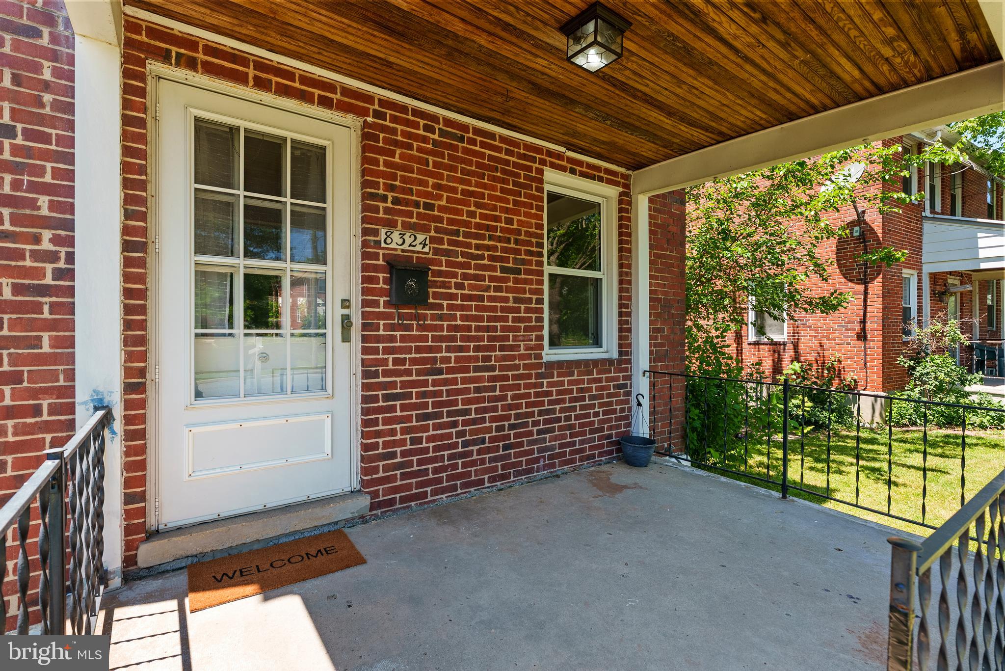Charming end of group brick rowhome in Parkville with brand new LVP floors, a covered front porch, and more space than you'd expect. Step inside to a bright living room that flows through an arched doorway into a well-appointed kitchen with white cabinets, gas range, stainless appliances, and a breakfast bar perfect for morning coffee. Sliding glass doors off the kitchen lead to the covered rear porch and a generously sized fenced yard with mature shade trees and plenty of room to grill, garden, or just enjoy summer. Upstairs, three bedrooms with original hardwood floors, ceiling fans throughout, and a full bath with subway tile and plantation shutters. The finished basement offers bonus living space could be a rec room, home office, or playroom as needed! With convenient amenities all minutes away, plus easy access to Loch Raven Reservoir for hiking and weekend trail runs, everything you need is close. Move right in and make it yours before summer hits its stride!
