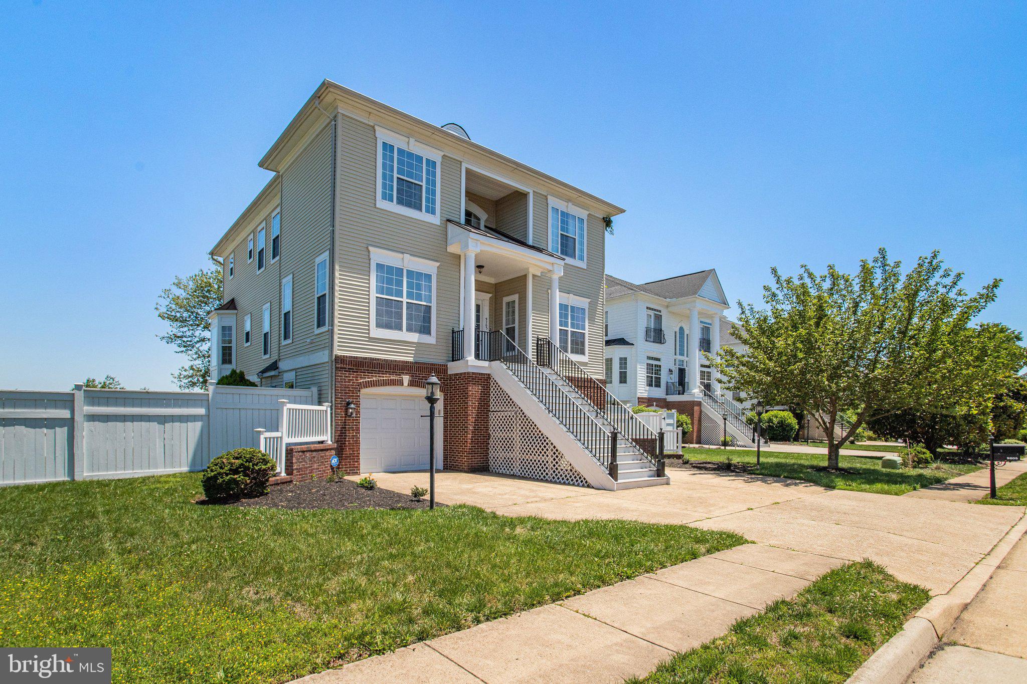 Some homes feel polished the moment you arrive, and this Colonial in John Leary has that easy, settled confidence. Set on a 0.24-acre corner cul-de-sac lot, it pairs classic curb appeal with the kind of interior space that makes daily life feel smoother: 3,534 finished square feet, 5 bedrooms, 3 full baths, 1 half bath, a 2-car attached garage, and multiple places to gather, unwind, work, host, or simply enjoy more room to breathe.

Step inside and the main level opens with a warm, welcoming rhythm. Hardwood floors, crown molding, chair-rail, and shadow-box detail, recessed lighting, and generous room sizes give the home a finished, intentional feel without making it precious. Formal living and dining spaces are ready for candlelit dinners, holiday spreads, and quiet evenings with the good dishes finally out of the cabinet. Toward the back, the floor plan relaxes into the spaces everyone gravitates toward: a spacious family room, a gas fireplace, and an eat-in gourmet kitchen that keeps the conversation close.

The kitchen is the heart of the home in the best way. Granite counters, an island, stainless steel appliances, gas cooking, a pantry, and abundant prep space make it practical on busy days and beautiful when guests are gathered nearby. There is room for coffee at the counter, a casual meal in the breakfast area, and that satisfying moment when the doors open to the deck and indoor-outdoor living becomes part of the routine. The deck, patio, fenced rear setting, and usable yard give you options: morning air, an evening drink, container gardens, a grill station, or a comfortable outdoor setup.
Upstairs, the private spaces are calm and well-proportioned. The primary suite offers the kind of retreat that makes the end of the day feel better, with a walk-in closet and a spa-inspired bath featuring a soaking tub, separate shower, double-sink vanity, and room to slow down. Additional bedrooms offer flexibility for guests, creative space, fitness, hobbies, study, or a quiet office setup. The upper-level laundry keeps everyday chores where they belong.

The finished lower level adds another layer of usefulness. With a large recreation area, full bath, finished utility space, and direct access to the backyard, it is ready for movie nights, games, project space, a second lounge, or a more private setup for extended stays. It is the kind of lower level that does not feel like an afterthought; it feels like more home.

The practical pieces are here, too: double-pane windows, central air, gas heat, public water and sewer, a security system, a shed for extra storage, and garage space with room to keep things organized. The HOA covers common area maintenance, trash, and snow removal.

And then there is the location. John Leary places you in one of Lorton’s most appealing pockets, close to the outdoor character that makes this part of Fairfax County feel different from the busier corridors nearby. Pohick Bay Regional Park offers a marina, boat launch, kayak and paddleboard rentals, camping, golf, mini golf, picnic areas, and wooded trails along the bay. Mason Neck State Park adds nature trails, paved multi-use trails, water views, wildlife watching, and a peaceful setting along the Potomac. Gunston Hall brings local history into the mix, while Lorton Station, Route 1, I-95, Fort Belvoir, the VRE, and the Auto Train keep commuting, dining, shopping, and weekend plans within easy reach.

This is a home with presence, comfort, and genuine versatility. It has the formal rooms when you want them, the open everyday spaces when you need them, and the outdoor connection that makes a house feel even larger than its square footage. It is classic without feeling dated, spacious without feeling empty, and polished without trying too hard. In Pohick Landing, surrounded by parks, water, history, and convenience, this Colonial is ready to be lived in beautifully.