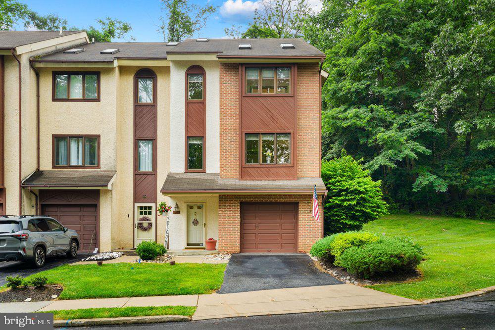 300 West Briar Drive, Media, PA — Rare End-Unit with Garage, 4 Bedrooms, 3.5 Baths & Beautiful Outdoor Living

Welcome to 300 West Briar Drive, a rare and spacious end-unit home offering approximately 2,349 square feet of beautiful, open living space in the award-winning Rose Tree Media School District. Built in 1990 and thoughtfully updated, this home offers the size, layout, and flexibility that are hard to find in this development.

The main living level features a large, functional kitchen with a breakfast bar, providing excellent workspace and casual seating. The kitchen opens nicely to the dining area and spacious family room, creating a comfortable flow for everyday living and entertaining. The family room is highlighted by a gas fireplace and a sliding glass door that leads to a beautiful custom-designed deck, overlooking gorgeous landscaping and offering a wonderful setting for outdoor relaxation, grilling, or entertaining.

This home offers 4 bedrooms total, including an upper-level area currently used as one of the bedrooms. This space provides excellent flexibility and could also serve as a teen suite, work-from-home office, gym, gaming room, media room, or private retreat. The lower-level bedroom includes an emergency egress window, adding valuable function and peace of mind.

The property also features 3 full bathrooms plus a powder room, giving the home excellent convenience for everyday living, guests, extended family, or those needing flexible living arrangements.

Another special feature is the private balcony deck off the second bedroom, which overlooks the beautifully landscaped setting and creates a peaceful outdoor escape.

Major updates include a newer roof, newer windows, and an updated and upgraded high-efficiency heating and central air conditioning system, giving buyers added comfort and peace of mind. The property also includes an enlarged one-car integral garage, which is larger than a typical one-car garage and is especially rare in this development, where only a limited number of homes include garages.

As an end unit, this home offers additional privacy, extra natural light, and one of the more desirable settings in the community. With its rare end-unit location, 4-bedroom layout, 3.5 baths, garage, updates, spacious square footage, multiple outdoor living areas, and convenient Media location, this is a unique opportunity at $479,900.