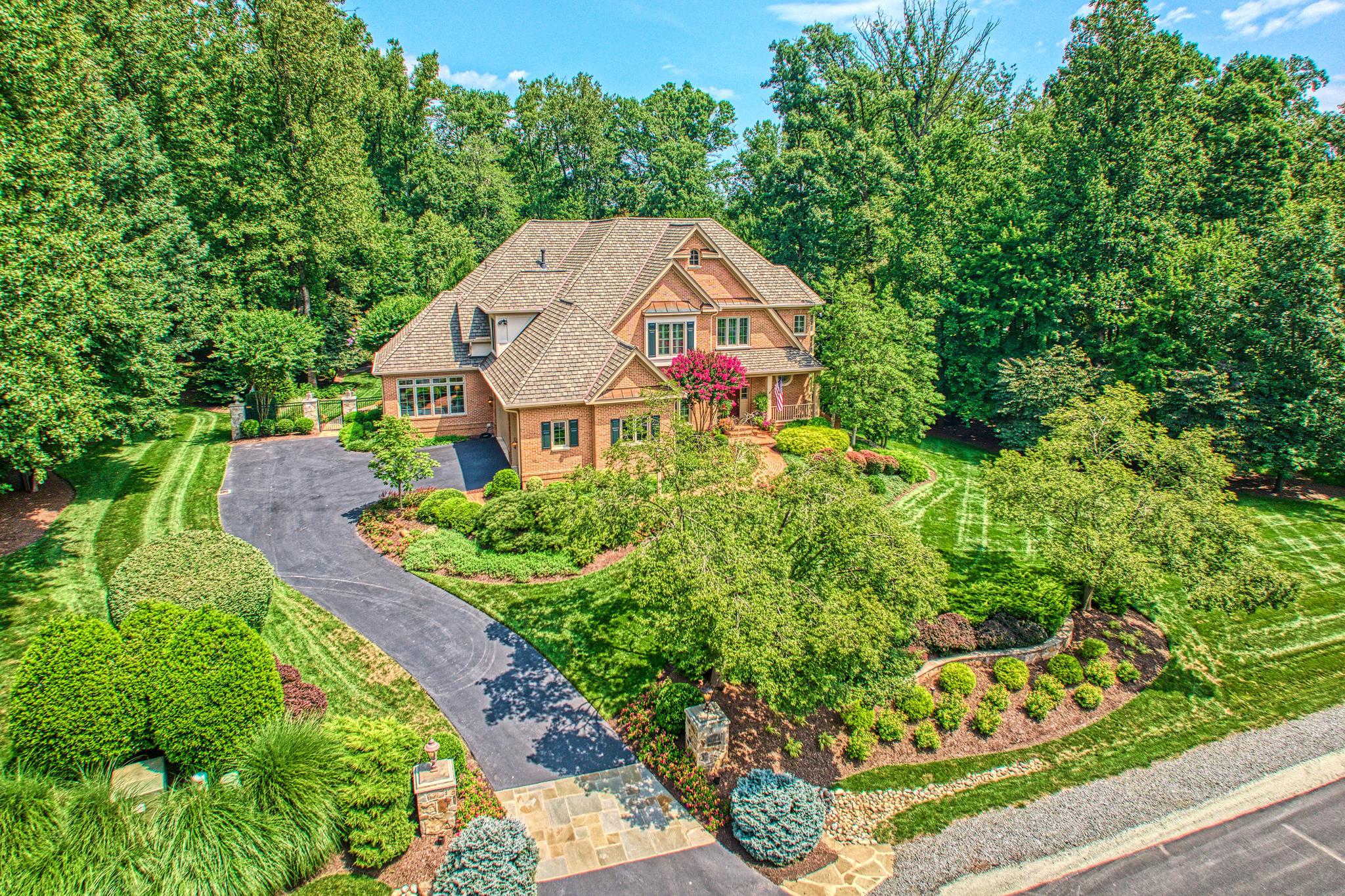 ORIGINALLY a semi-custom 6 bedroom home built in 2001, 10914 Shallow Creek presents today as a nearly new elegant, custom ALL BRICK home with approximately 8,000 sq ft of living space.
 THE ORIGINAL MAIN LEVEL includes a living room, dining room, sunroom, office, family room and powder room. No room untouched–each space has been carefully refined with meaningful upgrades. 
 THE BEDROOM LEVEL consisting of 4 BRs and 3 full Baths plus a cozy loft retreat has been expertly refined with quality upgrades.
THE LOWER LEVEL offers a large great room, game room, media room with wet bar, a 5th bedroom and full bath. Again, no room untouched    elevated finishes and improvements throughout.
The 2014 EXPANSION of a 23x23 low country style grand pavilion with a soaring, vaulted wood ceiling, windowed cupola with LED lighting, and automatic phantom screening extends the homes’ living area while maintaining connection to the surrounding landscape.
A SECOND 2014 EXPANSION  on the above ground lower level created a beautifully crafted study/guest/au pair/in-law suite complete with a beautifully appointed travertine-clad bath with a walk-in shower and custom made vanity. 
A TOTAL KITCHEN RENOVATION took place in 2021 and features Wolf/Subzero/Cove stainless steel appliances   2 dishwashers/3ovens/a 6-burner range w/ griddle, 48-inch side-by-side refrigerator, under counter beverage refrigerator & ice maker. Custom inset Wood-Mode cabinetry extends to full ceiling height & is paired with an oversized center island featuring striking Quartzite countertop.
ALL BATHROOMS (5.5 total) have been remodeled including adding heated flooring, Kohler fixtures and upscale lighting. The primary bath is highlighted with a custom digital, rimless glass-enclosed shower/heated floor, custom double vanities, integrated low-level  lighting providing both subtle illumination & a refined architectural effect.
A RESORT-STYLE POOL & GARDEN GROUNDS (2014):1.46 acres of privacy is centered around a heated saltwater pool & spa. Fountains, water features & ambient lighting add movement & atmosphere. Stone pathways guide you through beautifully landscaped gardens filled w/ perennials, ornamental grasses & flowering plants. Green Giant Arborvite form a natural privacy screen…total privacy and seclusion. Additionally there is a pergola, rose garden, a striking 3-tier fountain, all supported by a full irrigation system & low-voltage landscape lighting on  programmable timers.
TECHNOLOGY, SECURITY AND HOME SYSTEMS:  A comprehensive  ULTRA-GUARD security system includes high-definition cameras, crash & motion detectors, smoke, heat & carbon monoxide detectors are on all floors. Water sensors are located near key plumbing areas. (all mobile app controlled). There is a 4-zone HVAC system, including 2 TRANE natural gas systems, a steam-injected humidifier, 3 ENVIRO AIR UV LIGHT air cleaners, 3 Lennox E30 touchscreen thermostats (2021), a TRANE  heat pump, a LENNOX split-unit , ensuring efficient & precise climate control throughout.