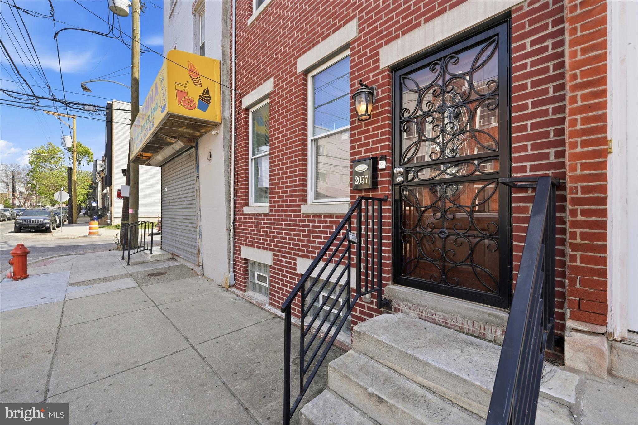 Welcome to 2057 N Franklin Street, a spacious and fully updated brick townhouse in the heart of Philadelphia’s Hartranft neighborhood, offering exceptional flexibility for investors or multi-generational living. This expansive three-story home with a full basement is zoned multifamily and features five generously sized bedrooms and five and a half bathrooms, along with an updated kitchen with stainless steel appliances, hardwood flooring, modern fixtures, and updated mechanicals throughout. With its size, layout, and proven track record of success for the current seller, this property is a strong Airbnb or short-term rental opportunity as well as an excellent long-term hold. Ideally located just minutes from Temple University, Broad Street, Center City, public transportation, neighborhood parks, and everyday dining and shopping, 2057 N Franklin Street offers the perfect blend of space, functionality, income potential, and convenience in one of North Philadelphia’s growing neighborhoods.