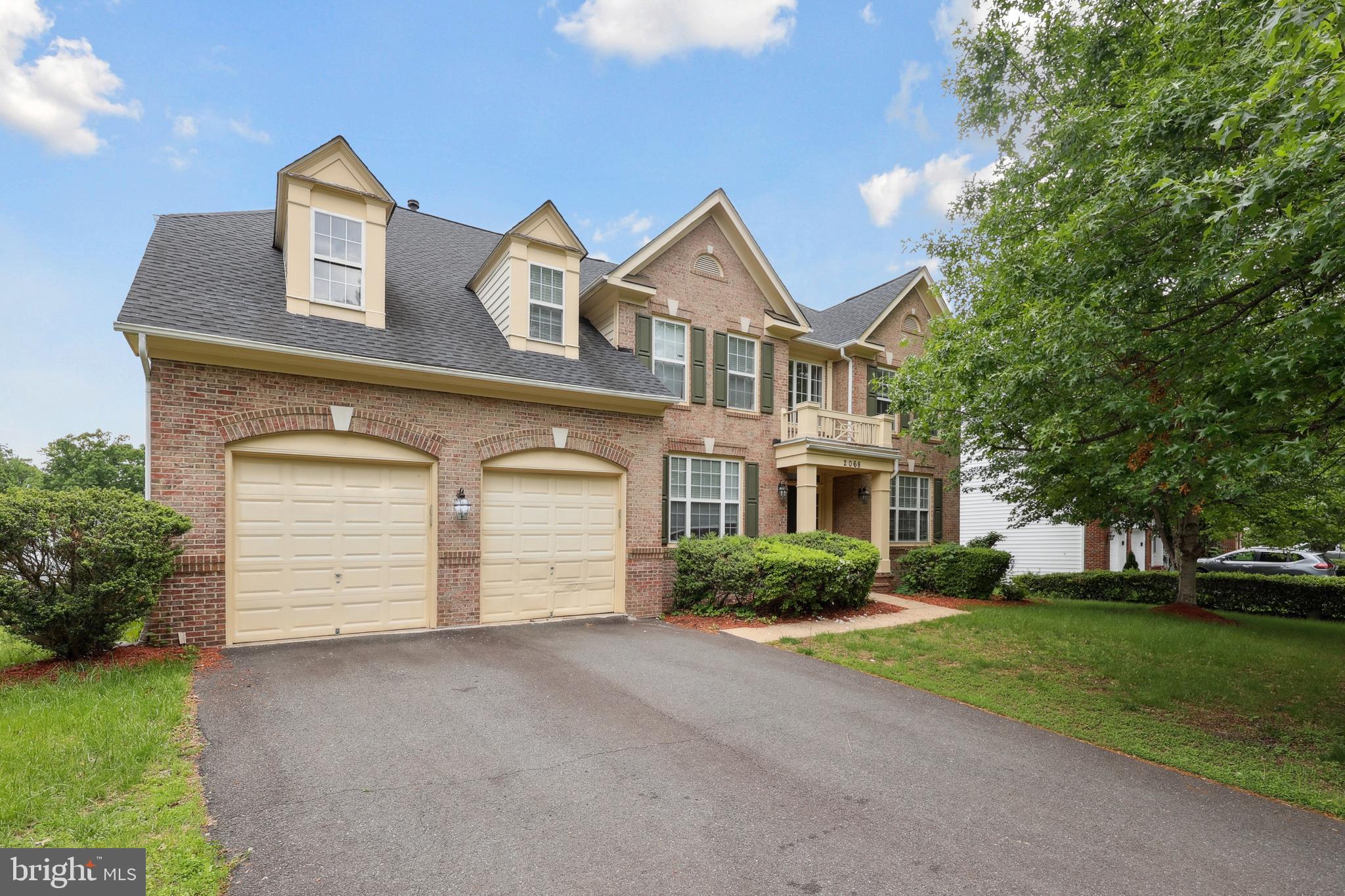 Welcome to 2068 Powells Landing Cir! This stunning brick home offers impressive square footage, charming curb appeal, and a functional layout. Upon entry, you're greeted by soaring ceilings and abundant natural light. To the right, you'll find a formal sitting room and dining room, while the traditional layout seamlessly blends the living room and kitchen. The bright and airy living room features atrium windows and access to the back deck. The kitchen is a chef’s dream with a large center island and breakfast bar, gas cooktop, updated cabinetry, granite countertops, stainless steel appliances, a pantry, and a large bay window. The main level includes a bedroom with an ensuite, perfect for guests or versatile needs. Upstairs, there are two bedrooms sharing a Jack-and-Jill bathroom, a bedroom with an ensuite, and the spacious primary suite. The primary bedroom boasts a sitting area and an ensuite with dual sinks, a soaking tub, and a standalone shower. In total, the home features three bedrooms with ensuites, all generously sized. The lower level offers additional living space with two storage rooms, a bedroom, and a full bathroom, ideal for extended living or a flex space. Outside, the large backyard provides ample room for outdoor activities. Conveniently located near Potomac Heritage Trail, Hamptons Landing Marina, Port Potomac Dog Park, and Powells Creek, this home truly has it all!  Per seller: Roof - 7 years old, HVAC - 5 years old, Water Heater - 2 years old.