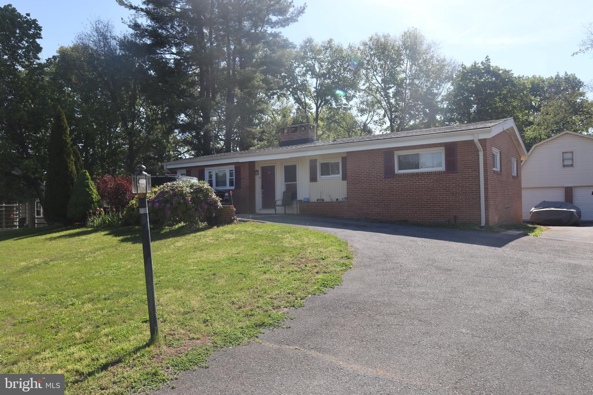 Very nice 3 bedroom 1.5 bath home in very desirable community. North end of Hagerstown. Wood burning fireplaces. Basement is finished with walkout door to rear yard. This is a unique home with exposed wood beams in living room ceiling.  Garage is oversized with large loft. Great for car enthusiast or work shop. Large rear yard. Roof on garage is 1year old and roof on house is 3 years old.