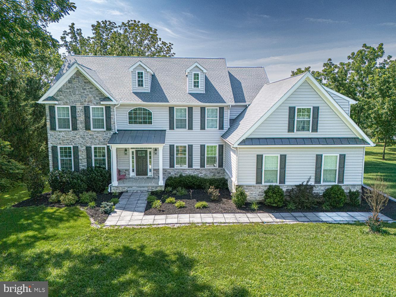 Welcome to this exceptional 5-bedroom, 3.5-bath home, nestled on a picturesque and private 1.75-acre lot in the highly sought after Garnet Valley Community! Built just recently and available only due to a relocation, this home combines modern luxury with an unbeatable setting. The heart of the home is the stunning chef's kitchen, featuring gleaming quartz countertops, premium appliances, a stylish tile backsplash, beverage center, pot filler, and a 5-burner commercial-style cooktop. Beautiful white oak flooring flows throughout the first floor, complemented by a convenient rear staircase, an impressive family room with soaring vaulted ceilings, and a cozy gas fireplace. Step outside to the spacious rear deck and take in the peaceful views that surround the property. The expansive backyard offers exceptional privacy, and a walking path at the rear of the property provides convenient access to Garnet Valley High School. Upstairs, you'll find four generously sized bedrooms, including an extraordinary primary suite complete with a luxurious spa-inspired bath and an oversized bonus room—perfect for a home office, fitness studio, sitting room, or private retreat. The finished walkout lower level is designed for entertaining and everyday enjoyment, offering a spacious recreation area with access to a beautiful patio, a fifth bedroom, a full bath, and your very own home sauna. Offering the perfect blend of luxury, privacy, and convenience, this remarkable property is just minutes from Wegmans, Whole Foods, fine dining, shopping, and the renowned cultural attractions of the Brandywine Valley. Set on a spectacular 1.75-acre homesite in the acclaimed Garnet Valley School District, this home truly has it all.

Welcome Home!