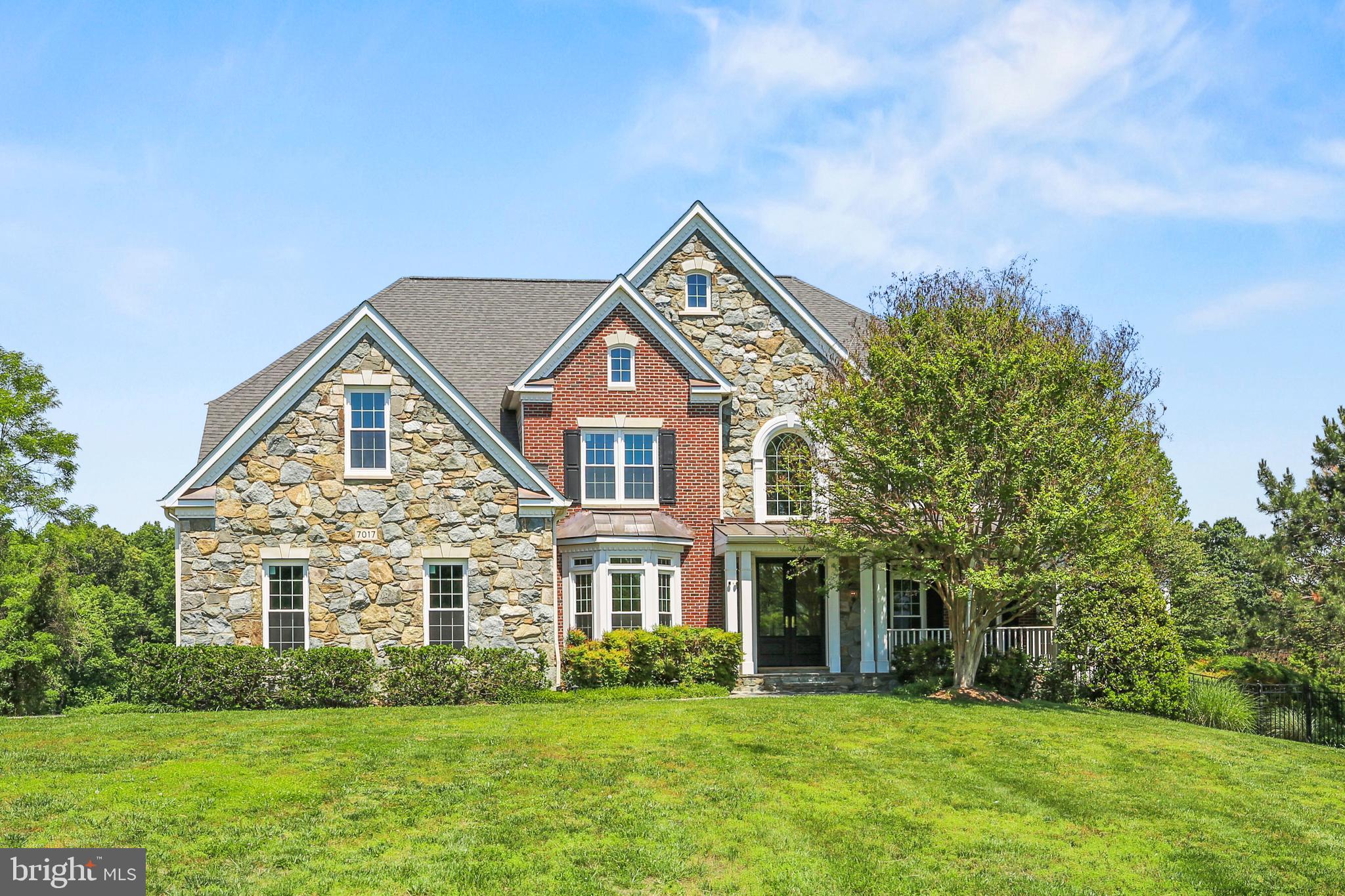 Introducing 7017 Cypress Hills Drive, a spectacular Winchester Homes estate nestled within the prestigious Brookefield community of Gaithersburg. Perfectly positioned on a breathtaking 2-acre lot backing to scenic farmland, this exceptional residence offers a rare combination of privacy, luxury, and tranquility. Enjoy peaceful countryside views, colorful sunsets, and the unique charm of watching wildlife and grazing farm animals just beyond your backyard, all while remaining minutes from major commuter routes, shopping, dining, and everyday conveniences.

Offering more than 7,000 square feet of beautifully designed living space, this impressive colonial combines timeless elegance with the scale and functionality today's buyers desire. A dramatic two-story foyer welcomes you inside, where rich wood flooring, soaring 10-foot ceilings, and expansive room sizes create an atmosphere of sophistication and comfort. The thoughtfully designed main level features a private office, rear and side solariums filled with natural light, a convenient back staircase, and a stunning family room anchored by a striking brick fireplace.

Upstairs, the luxurious primary suite serves as a true private retreat, complete with a spacious sitting room, wet bar, spa-inspired bath, and generous walk-in closets. Three additional bedrooms and two full baths provide comfortable accommodations for family and guests alike.

The finished lower level is designed for entertainment and recreation, featuring a dedicated theater room with all seating and equipment conveying, creating an incredible movie-night experience from day one.

Step outside and discover your own private resort. The spectacular outdoor living area showcases a resort-style pool with swim-up bar, outdoor kitchen, firepit, and multiple gathering spaces designed for everything from intimate evenings to large-scale entertaining. Whether hosting summer pool parties, enjoying quiet mornings overlooking the farmland, or relaxing under the stars, this outdoor oasis delivers an exceptional lifestyle rarely found in Montgomery County.

Complete with a side-load three-car garage, ample driveway parking, and numerous major system updates, this remarkable property offers the perfect blend of luxury, comfort, and everyday livability in one of the area's most sought-after communities.