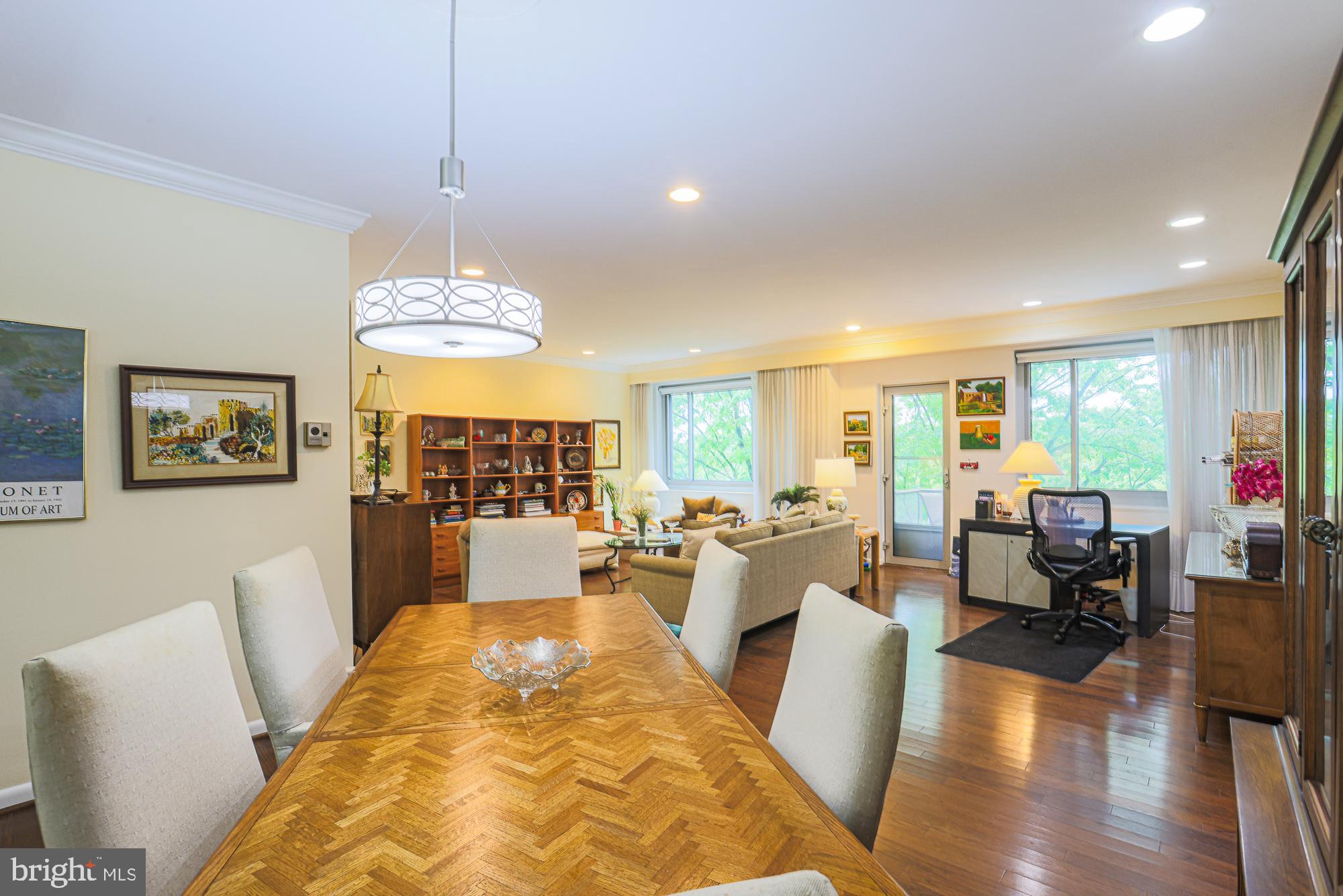 Every once in a while, a property comes along that feels good the minute you walk through the door, and Unit 610 is exactly that kind of home. 
Located on the sixth floor, this beautiful two-bedroom, two-bath luxury  has the kind of gracious, comfortable feeling that is getting harder and harder to find. The current owner has used the second bedroom as a den with lovely glass French doors, creating a flexible space that could work beautifully as a guest room, office, reading room, TV room, or quiet retreat. 
The living room and dining room are oversized, filled with light from a wall of windows, and open to a balcony with wonderful views. Creative furniture placement allows for a home office with a view. The marble foyer and hardwood floors are absolutely beautiful and give the entire apartment a warm, sophisticated feel.
And then there is the kitchen. This is not your typical apartment kitchen.
It is large, bright, updated, and has a mirrored backsplash, bright windows, and is thoughtfully designed, with cabinets that reach the ceiling and excellent pull-out shelves in the pantry storage. 
Still, in the kitchen, there is enough room for an eating area, a television, a sofa, and sitting space. It truly becomes part of the living area rather than just a place to cook.  
The primary bedroom is spacious with wonderful closet space, and both bathrooms have been tastefully updated with walk-in showers and are beautifully maintained.  
Eleven Slade Co-op is a full-service building with a gym, valet parking, and so much more! Cash only sales.