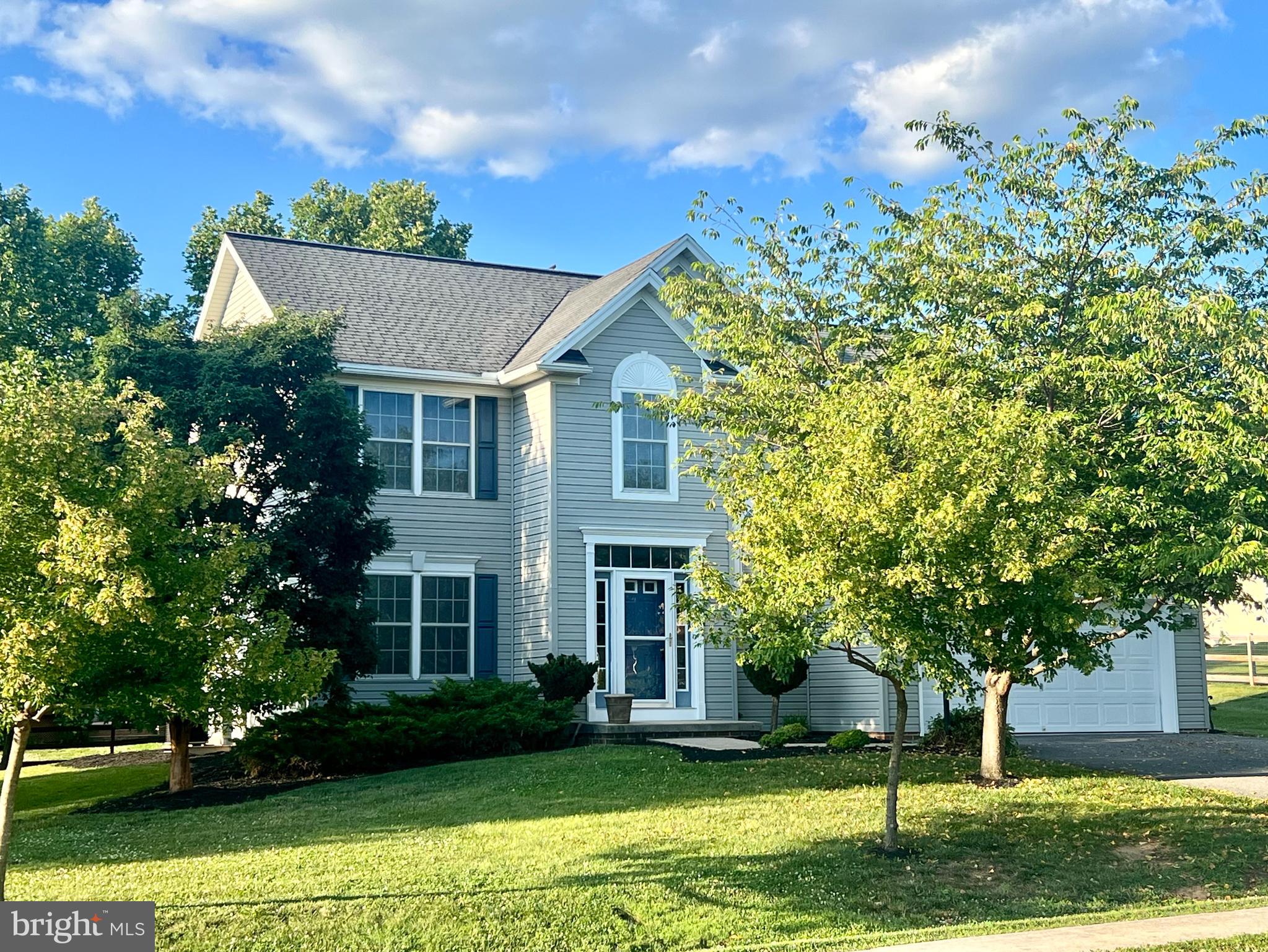 Are you looking for a home in an established neighborhood with a great backyard, even a swing on a tree, neighborhood sidewalks for morning, noon or evening walks, close to the Maryland line and interstate access plus an oversized two-car garage and large driveway?  Come inside and find a beautiful two-story, foyer, half bath, hall closet, separate dining room, a kitchen with island, pantry, breakfast nook, sliding doors to the back and a large family rm with laminate wood flooring.  New light fixtures, new fresh paint, new steps to the backyard all waiting for you.  Continue to the second floor for a primary master bedroom with laminate wood flooring, large walk-in closet and primary bath with separate tub, separate shower and dual vanity.   Upper level laundry room with washer and dryer, hall bath and three generous sized bedrooms with carpet. The home’s crawlspace, which Seller used for storage, is accessed from the main level closet area.   Home with beautiful new landscaping, trees and plenty of perennials around the home. This is the perfect time of year to make your move and get ready for 2027!
