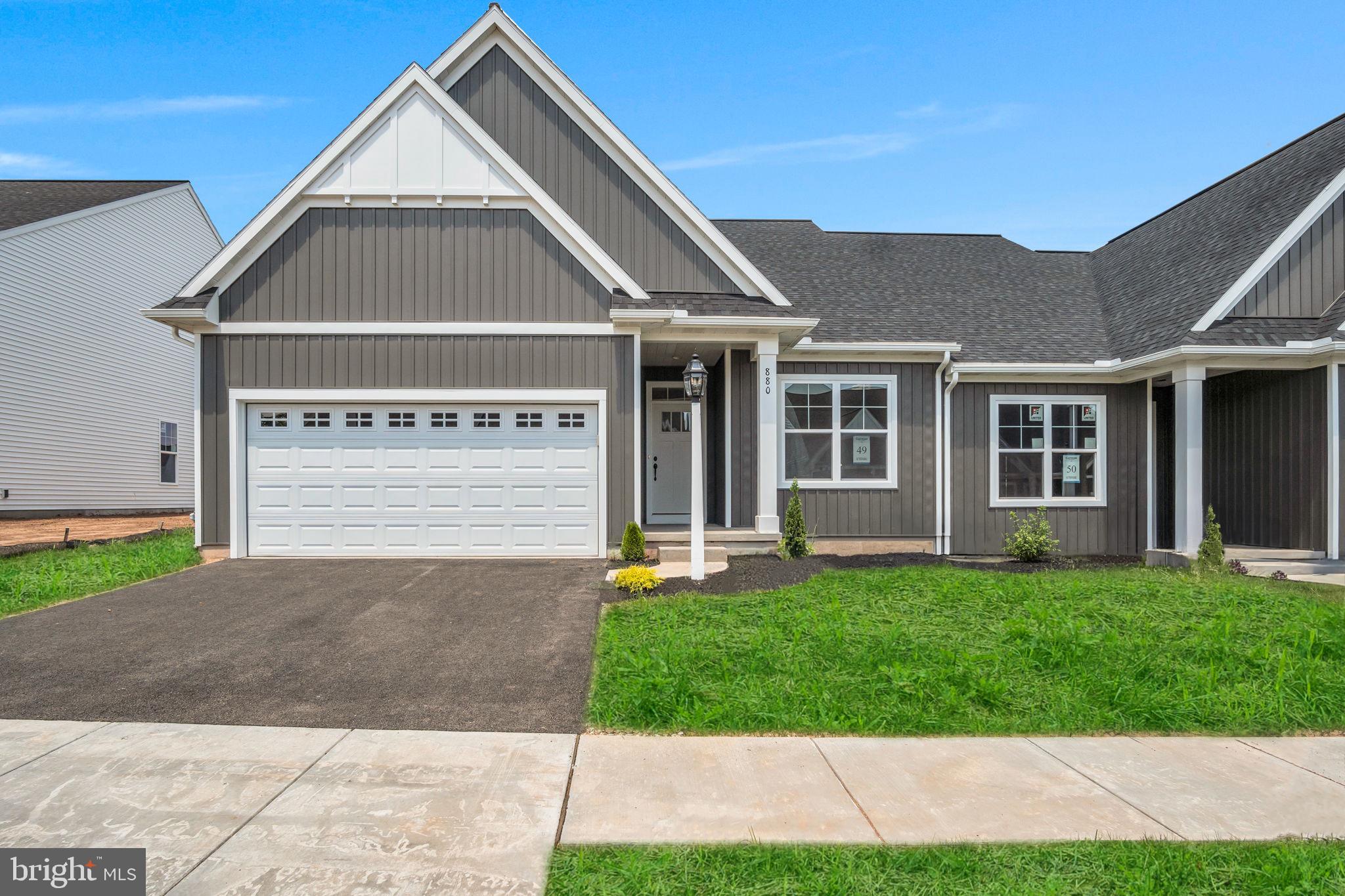 This charming home by Garman Builders offers an ideal combination of space and style. The Maeve model features 2 spacious bedrooms and 2 full baths with 1,690  sq. ft. of well-designed living space. Inside, you'll be greeted by a stunning vaulted ceiling that adds a sense of openness and elegance. Step outside to a private concrete patio—perfect for enjoying outdoor moments. With thoughtful upgrades throughout, this home offers both comfort and convenience. Located in York County's premier 55+ community, it's the perfect place to enjoy a vibrant, peaceful lifestyle. Come see why this could be your perfect new home! This home is set to be completed 5/7/2026. Photos are of a previously built home, just reference.