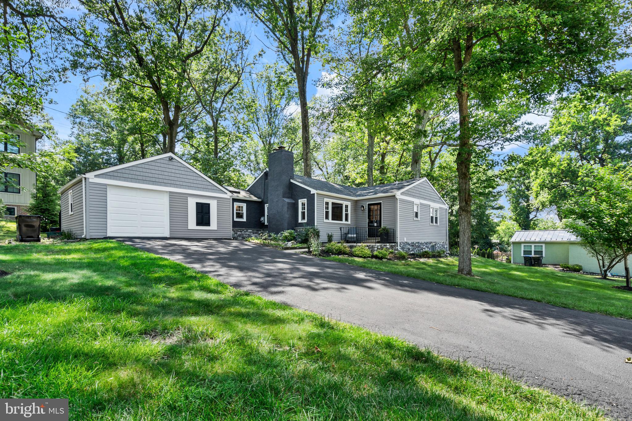 Home isn’t just a place—it’s a feeling.  Welcome to this beautifully renovated 4-bedroom, 3 full bathroom ranch home with a one-car garage, thoughtfully updated with exceptional attention to detail. Ideally located less than a 4-minute walk to Conestoga High School—ranked #2 in Pennsylvania by Niche and among the top schools in the state by U.S. News & World Report—this home offers both luxury and convenience in one of the Main Line’s most desirable neighborhoods.
   Step inside to a welcoming entry hall that opens to a sun-filled living room featuring refinished hardwood floors, recessed lighting, and a charming wood-burning fireplace with new chimney liner. The spacious dining room flows seamlessly from the living area, creating an ideal layout for everyday living, entertaining, and fine dining.
The heart of the home is the expansive, enlarged eat-in kitchen, designed to impress. Highlights include a skylight, quartz countertops, marble backsplash, abundant 42-inch white shaker cabinetry, a pantry closet, coffee bar, recessed lighting, and stainless-steel appliances, including a convection/conduction cooktop. The kitchen opens directly to a large stone paver patio with black aluminum fencing, offering peaceful nature views and the perfect indoor-outdoor lifestyle.
    Three sun-filled bedrooms feature plantation shutters, refinished hardwood floors, and recessed lighting, along with an enhanced primary bedroom closet. The enlarged primary bathroom boasts an oversized seamless glass stall shower with bench seating, a contemporary vanity, and designer tile throughout. A beautifully updated hall bathroom includes a soaking tub, designer tile, recessed lighting, and a convenient stackable washer and dryer.
   The lower level significantly expands your living space with a fully finished basement designed for flexibility and comfort. Featuring durable polyaspartic-coated flooring, recessed lighting, and abundant electrical outlets, this level is ideal for entertaining, recreation, or extended living. A remodeled full bathroom includes a tub, sink, and new vanity. The fourth bedroom offers recessed lighting, newer carpet, and a large, refinished closet. A separate, remodeled laundry room with recessed lighting and a full-size washer and dryer provides added convenience. The expansive layout offers endless possibilities—whether you envision a media room, home gym, in-law suite, or private guest quarters.
   Set on an impressive 0.68-acre lot, the property offers a partially fenced yard with elegant black aluminum fencing, a stunning stone paver patio, and a dedicated barbecue area that flows into a white stone fire pit space. Surrounded by mature oak, maple, and walnut trees, the setting is serene and private, with birdsong providing a tranquil backdrop.
   Enjoy close proximity to local favorites including Whole Foods Market, Handel’s Homemade Ice Cream, and Autograph Brasserie. Nearby attractions such as the Devon Horse Show and Country Fair, Jenkins Arboretum & Gardens, Wilson Farm Park, and Westover Bird Sanctuary provide endless opportunities for outdoor enjoyment.  Commuters will appreciate easy access to Berwyn Station for direct service to Center City, as well as proximity to King of Prussia Mall and IMAX theaters.
This home seamlessly blends modern living, natural beauty, and an unbeatable location—offering a lifestyle that is as comfortable as it is connected.
