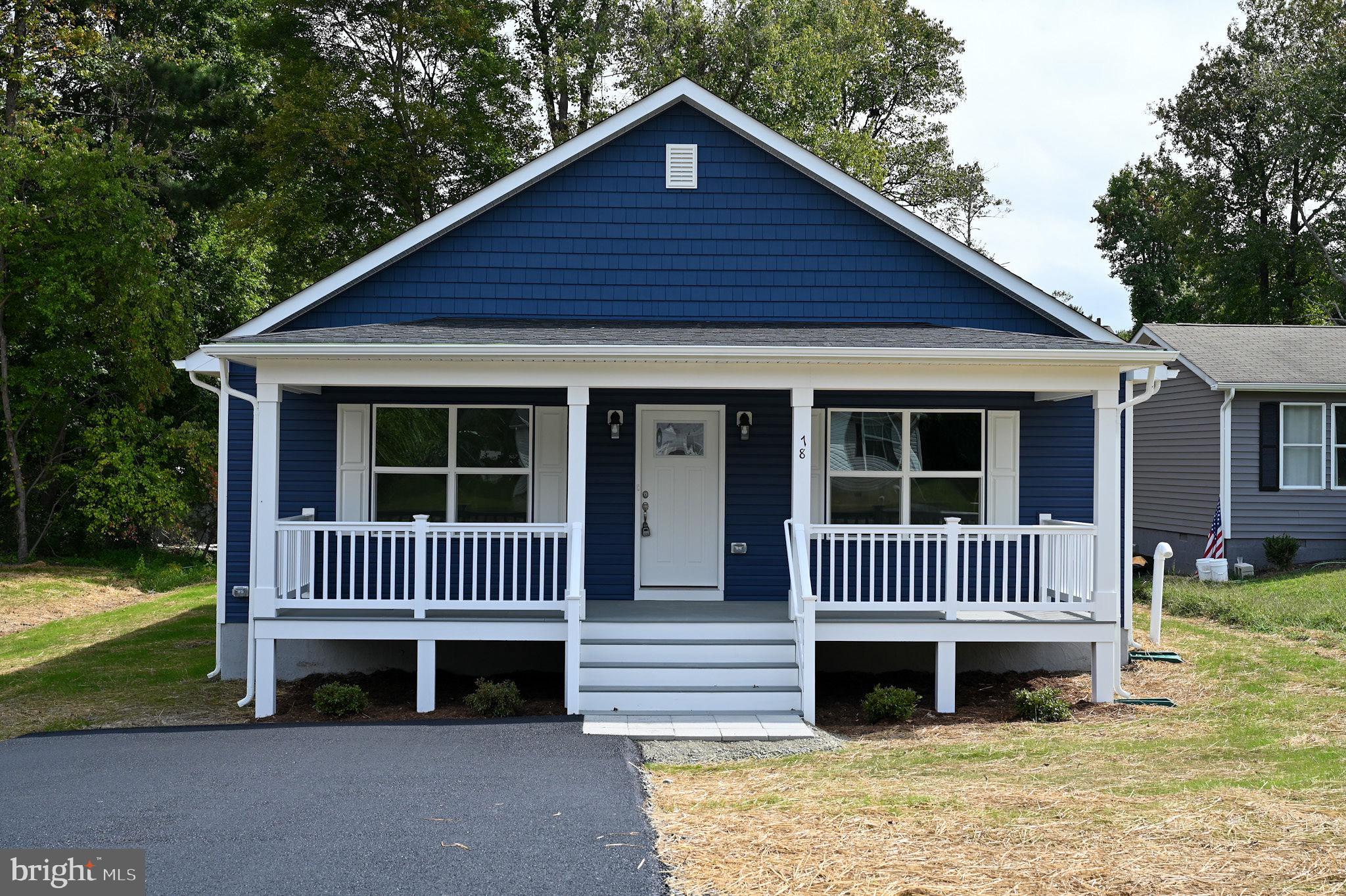 MOVE IN READY - A charming ranch style house for sale in Placid Bay Estates near Colonial Beach, VA.  One floor living with flowing floorpan. Kitchen with upgraded granite countertops, upgraded cabinets, and GE appliances. Pella windows. Upgraded LVP flooring throughout. Custom paint colors. Beautiful low-maintenance Timber-tech front & back porches.  Back porch with room for seating or grilling.