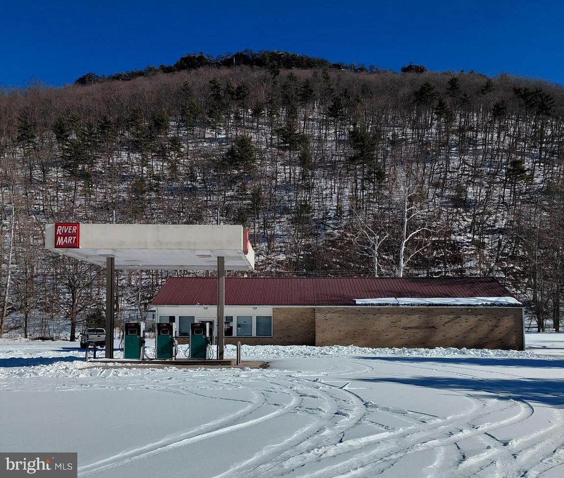 Once-in-a-lifetime investment opportunity in the heart of Riverton, WV. Formerly known as the Old River Mart, this closed gas station sits on approximately 2.7 acres in a highly traveled tourism corridor surrounded by some of Pendleton County’s most popular destinations. Located near the river, close to fish stocking areas, and just minutes from Seneca Caverns and the scenic Germany Valley, this property benefits from consistent local and tourist traffic year-round.

This site was previously one of the only locations in the area offering 24-hour fuel access, making it a well-known stop for locals, travelers, and outdoor enthusiasts. Although the business closed in March 2025, the foundation for a strong operation remains in place for the right investor willing to update, improve, and bring it back to life.

The store currently contains a large amount of non-expired inventory, including hardware, tools, and fishing equipment, which may convey with the sale or be negotiated separately. All expired food products have been removed. With fuel service reinstated and the store refreshed, this property offers multiple possibilities — from a reopened convenience store and gas station to a tourism-focused retail stop serving anglers, campers, and travelers.

This is an ideal opportunity for an owner-operator or investor looking to revive an established location in a proven area. With vision and effort, this property has the potential to become a thriving business once again. Properties like this — with acreage, location, and name recognition — rarely come available.
