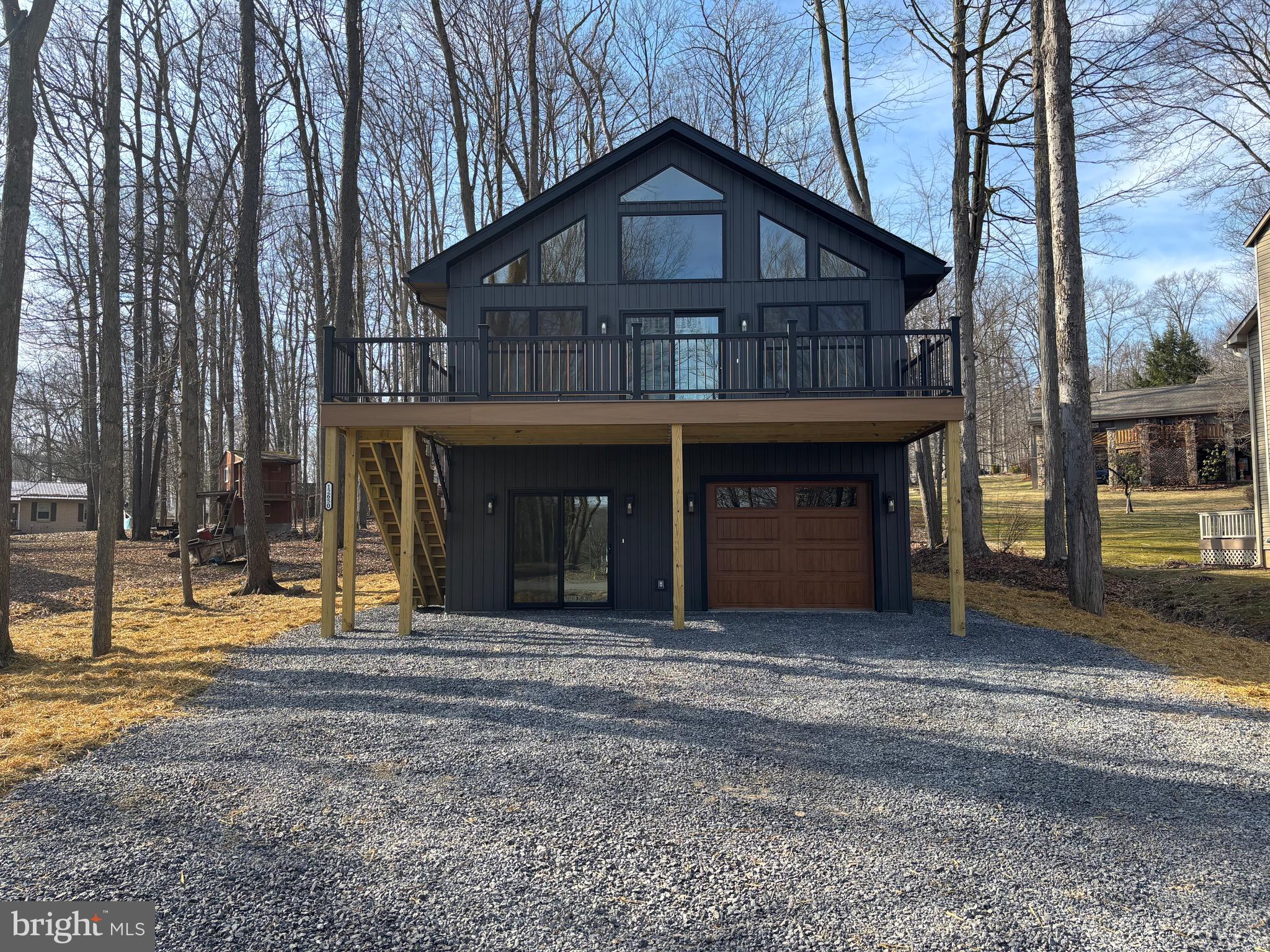 Welcome to this stunning brand-new construction, ideally located in the heart of Treasure Lake. This home offers breathtaking views of the water, with the serene beauty of the lake just steps away. Enjoy walking distance to the marina for easy access to all your boating and water activities. The iconic Lake View Lodge is also in full eyesight, adding to the charm of this picturesque setting.

Inside, you’ll find a luxurious living space complete with a beautiful fireplace, perfect for relaxing after a day by the water. Step outside to your second-story deck, offering wide views of the lake—ideal for enjoying a quiet morning or watching the sunset. This is truly a lakeside retreat at its finest, blending modern luxury with nature’s tranquility.

Update- The yard has been filled, grated, leveled, seeded and covered with hay. 

This is a FSBO, please contact me for data sheet and contact information