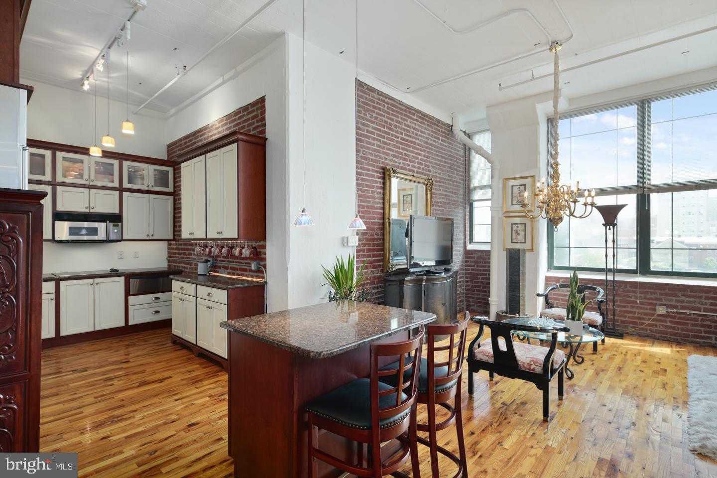 Don't miss out on this spectacular one-of-a-kind luxury loft just minutes away from Center City Philadelphia! The Old Shoe Factory has been converted into gorgeous New York Style flats. This space is truly incredible for city living with a custom-made beautiful kitchen, updated appliances, top of the line stainless steel Subzero fridge and granite countertops and a matching island/breakfast bar. Storage is the name of the game in lofts and this unit has closets galore! A custom built closet space along one wall of the bedroom and in the main living area and a laundry room with washer/dryer and lots of storage shelving. Large windows with plenty of sunlight! Gorgeous hardwood floors throughout entire unit. Unit can be easily converted into a two bedroom if desired. Low taxes and condo fees and just blocks from Reading Terminal Market, SEPTA, shopping, restaurants, buses to NYC and DC, and short walks to Center City, Old City and Chinatown right from your front door! Also, centrally located between the Art Museum/Ben Franklin Parkway area with all of its wonderful museums and cultural offerings to the west and the Northern Liberties neighborhood with its bars, restaurants, and shopping to the east. Newly completely renovated building across the street is perfect for bunch or just a relaxing time! If developers are investing in this neighborhood shouldn't you? Don't let this impeccable unit pass you by!    Price: $342,900.00