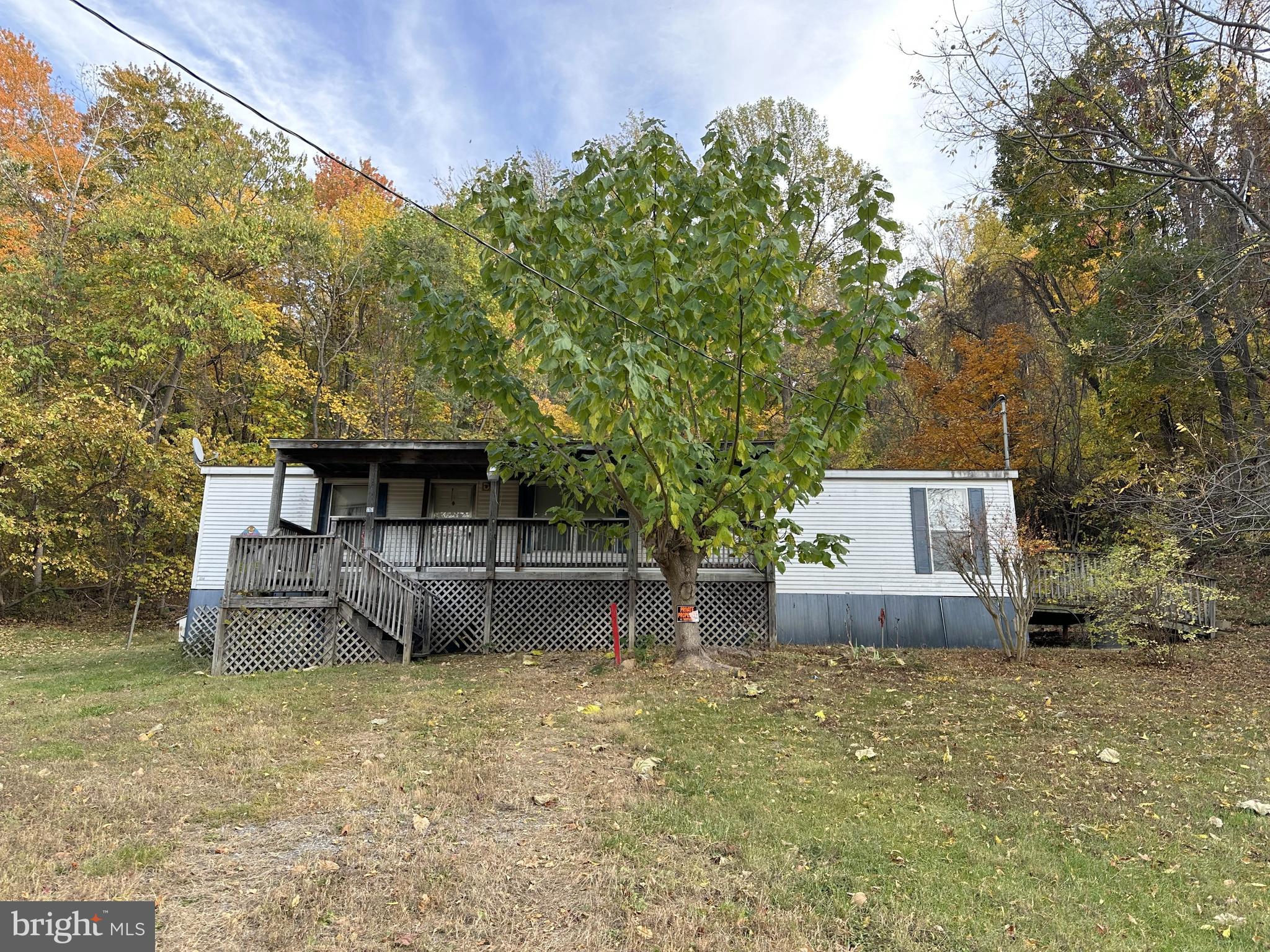 Handyman Special!  This manufactured home needs  some work but would make an affordable home or investment property.  Features 3 BR, 2 Baths, Living Room, Eat in Kitchen and Laundry Room.  All situated on nice .90 acre lot in nice country setting with outbuildings.  The sale is contingent upon court approval.